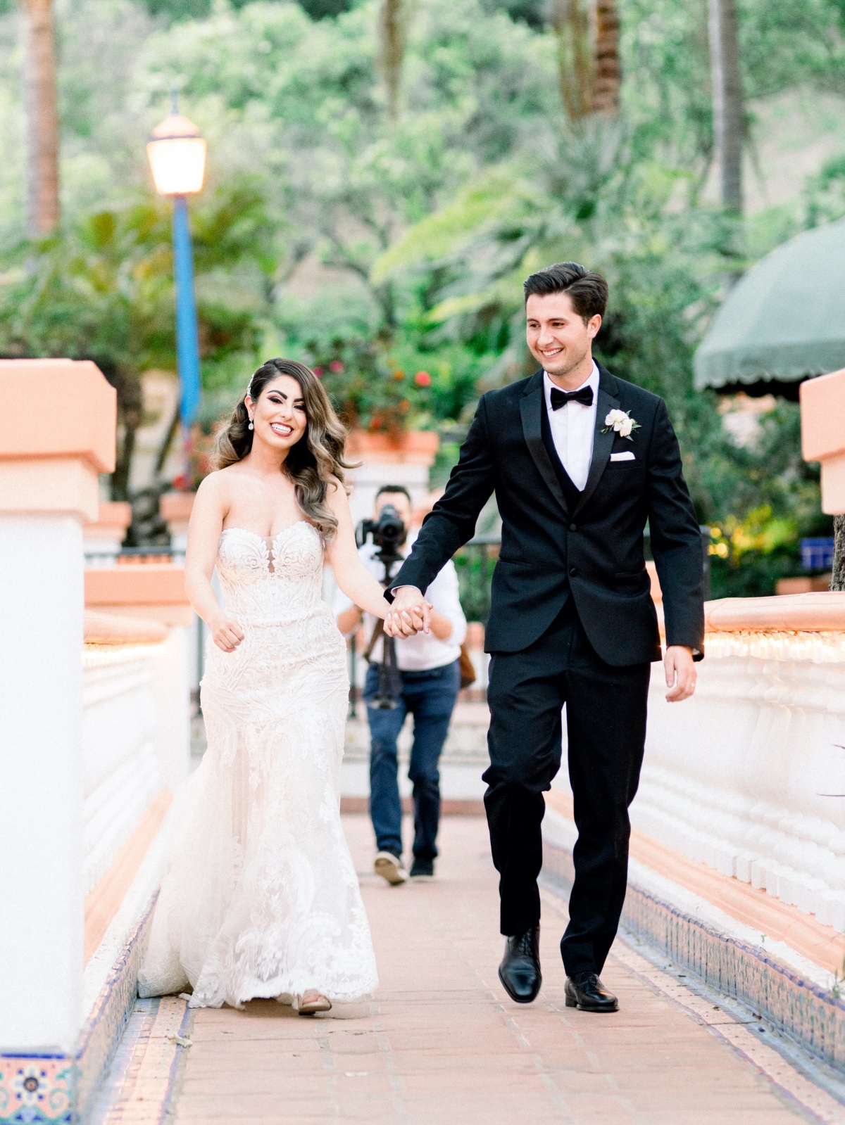 Bride and groom holding hands at their wedding