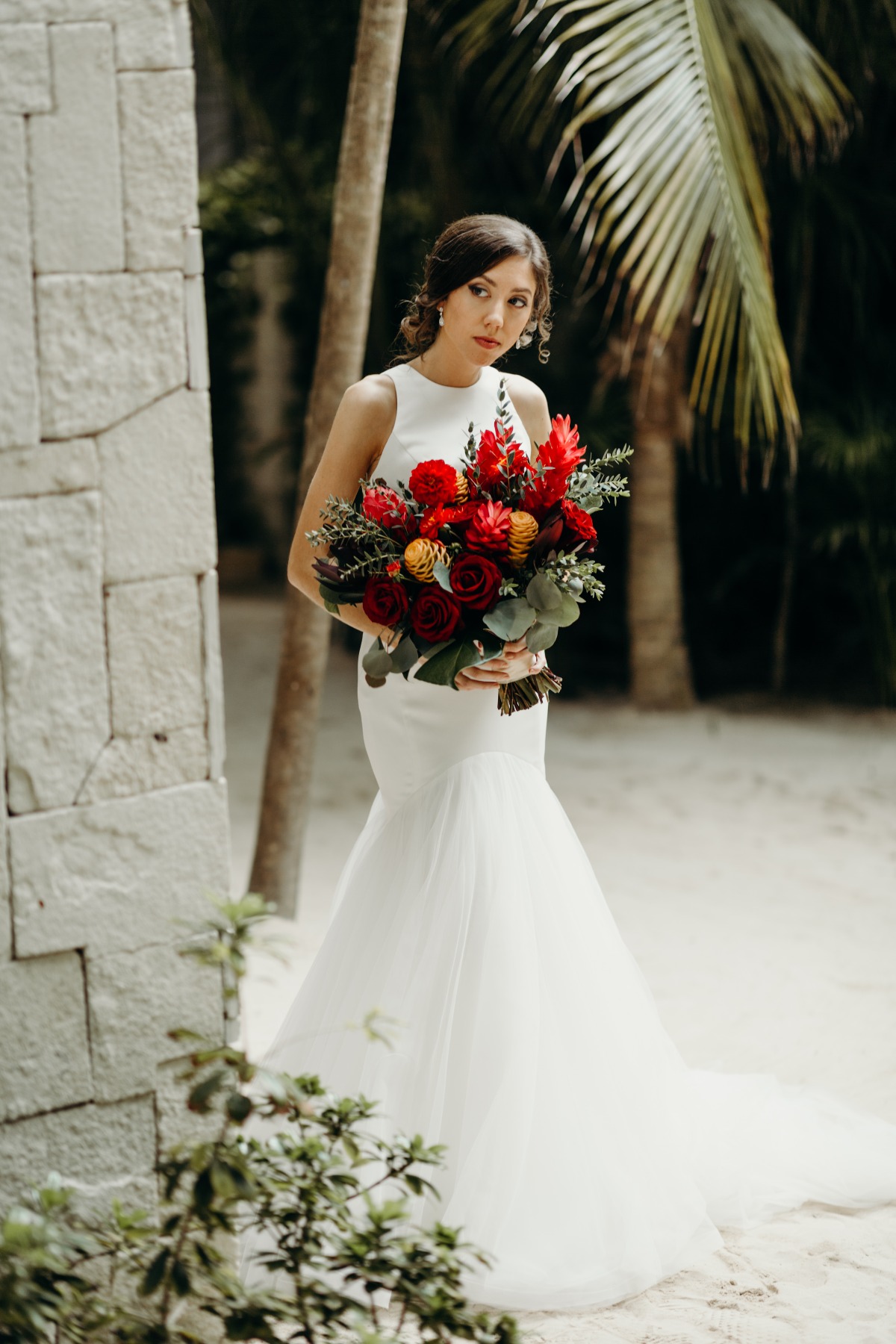 Mermaid wedding dress paired with tropical wedding bouquet