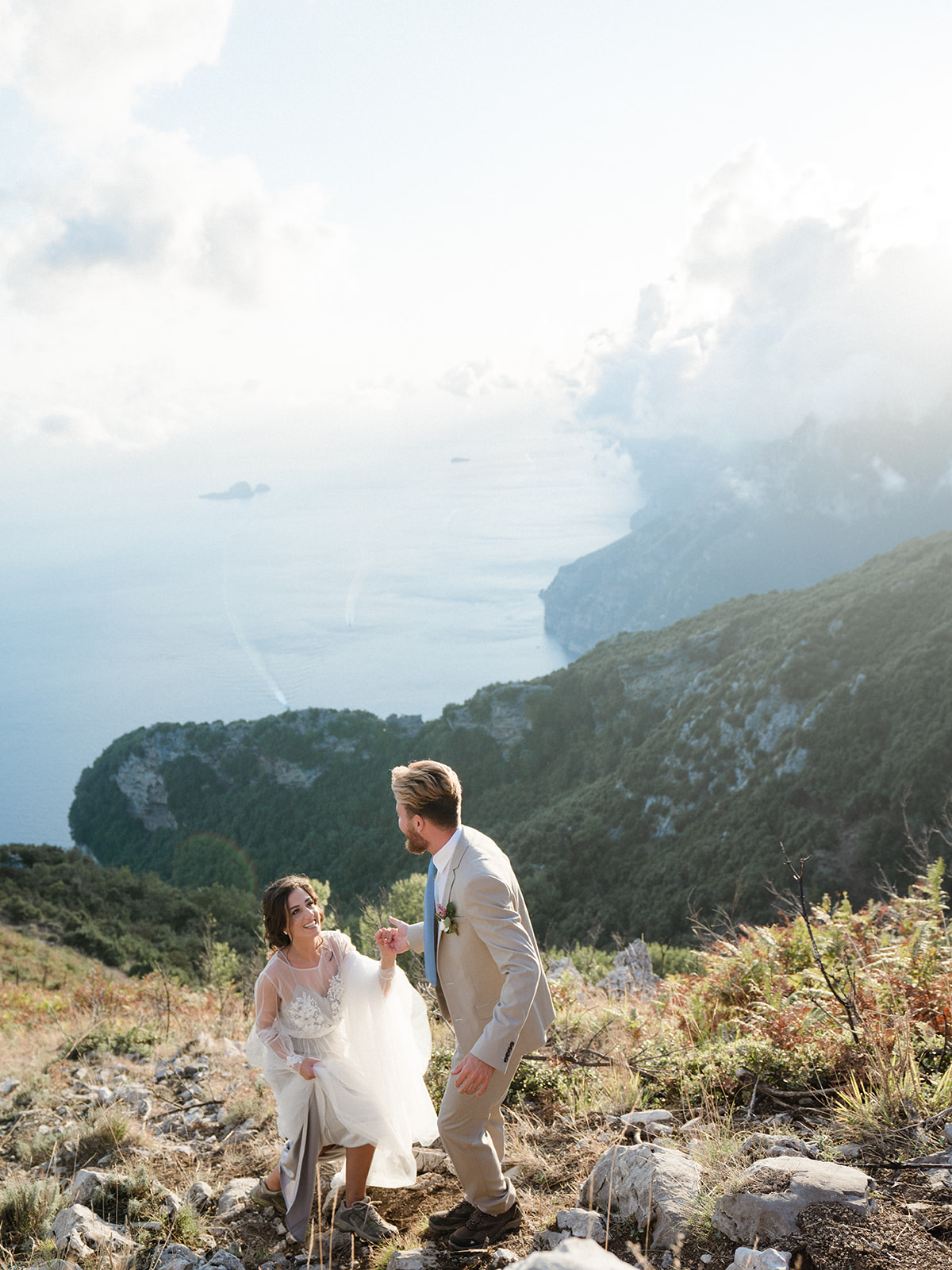 couple hikes up to The Path of the Gods for elopement