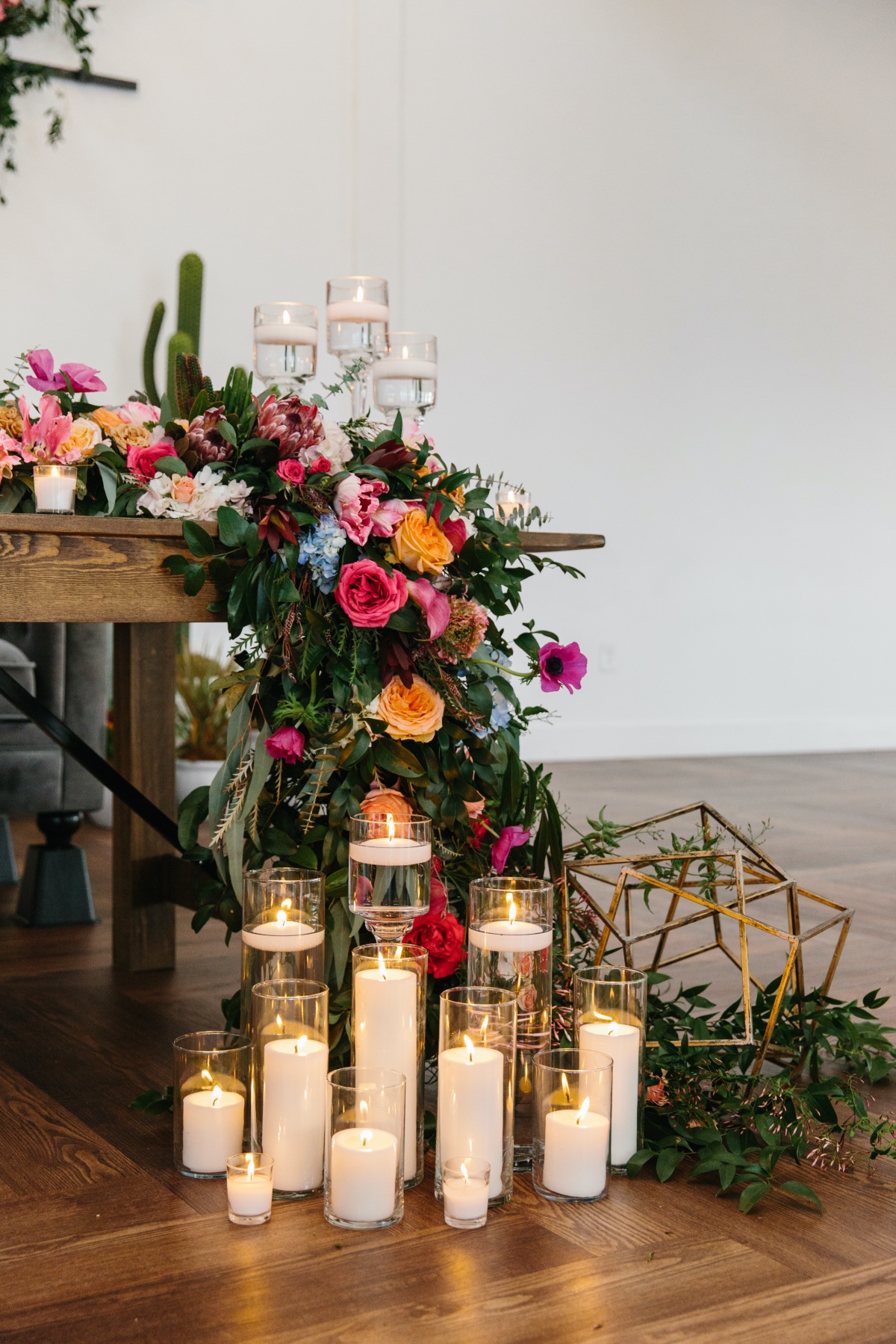 candles in front of sweetheart table