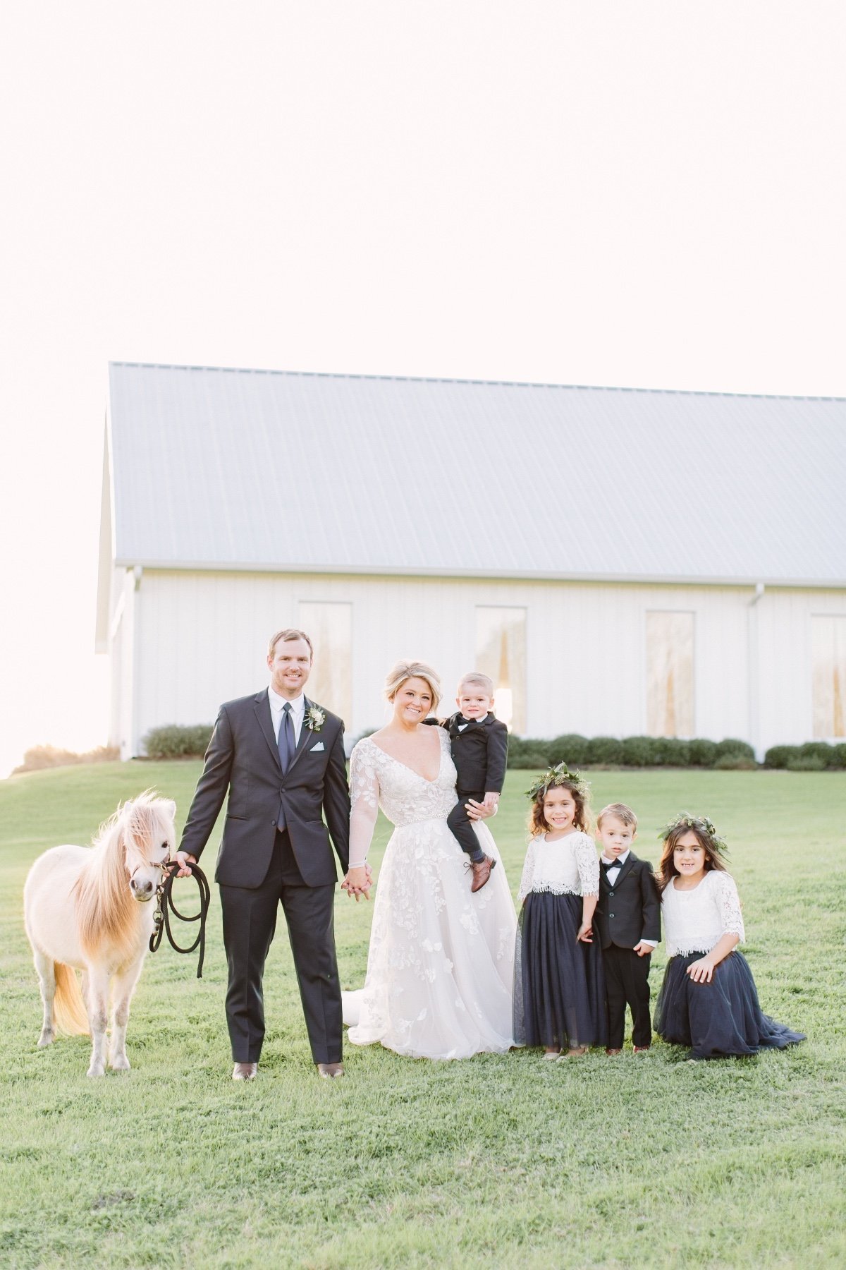 wedding portrait with flower girl and ring bearer