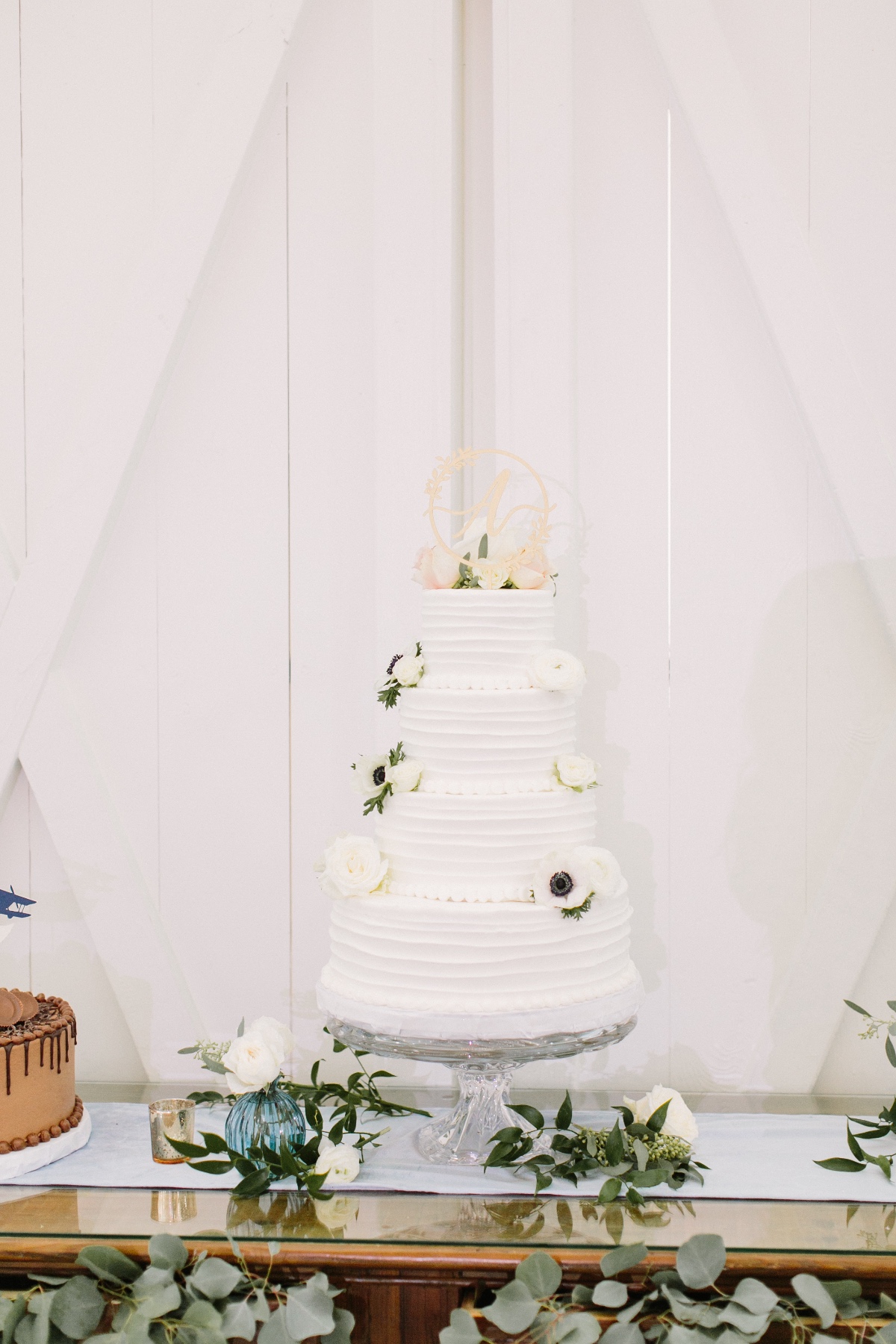 white wedding cake with cake topper