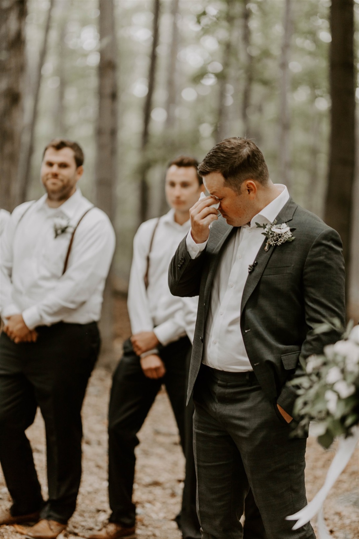Groom crying at the alter