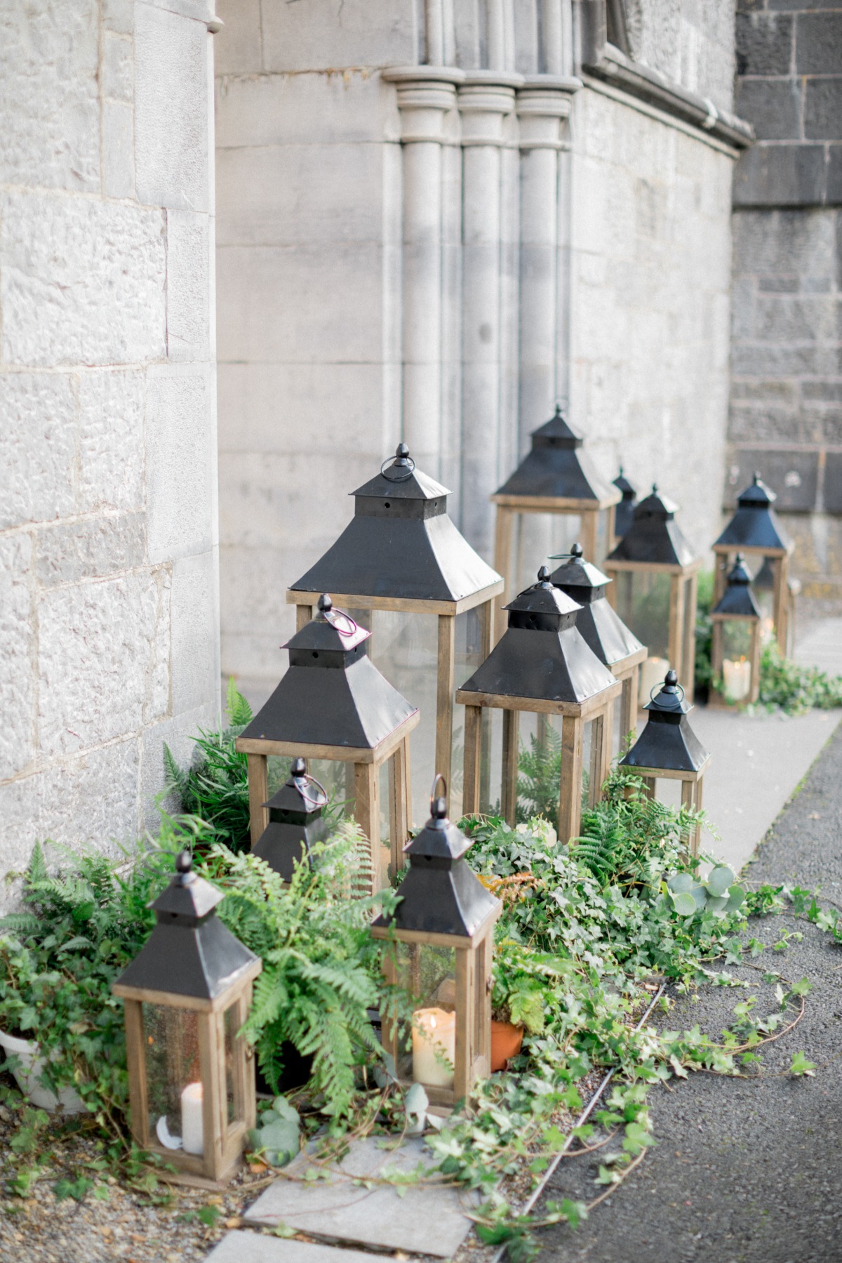 Church decorated with ivy and lanterns for wedding ceremony