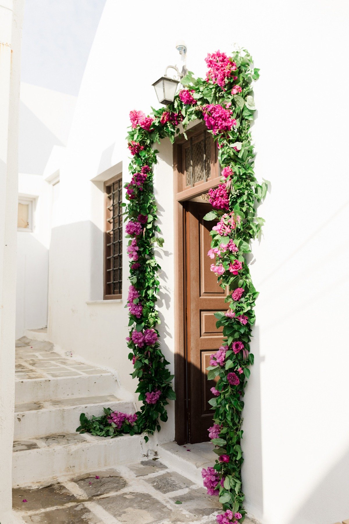 door way adorned with greener and magenta florals