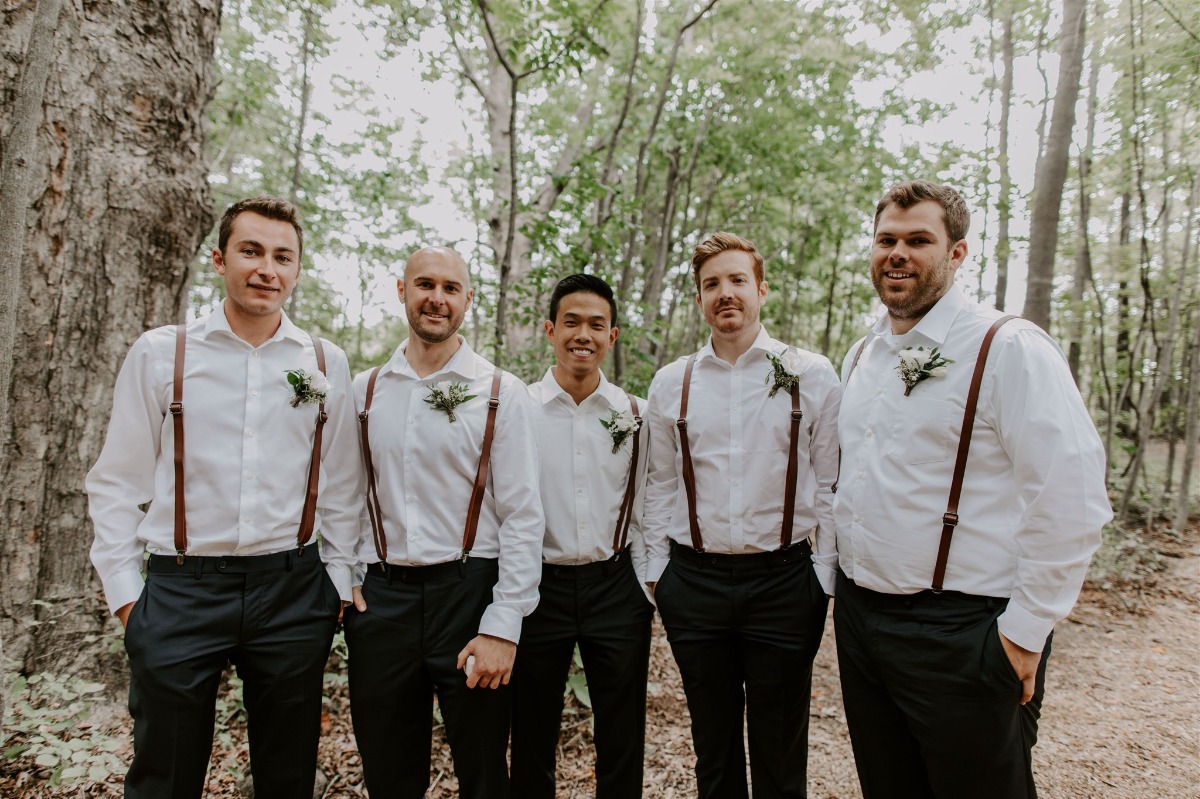 groomsmen in overalls, navy pants and brown shoes