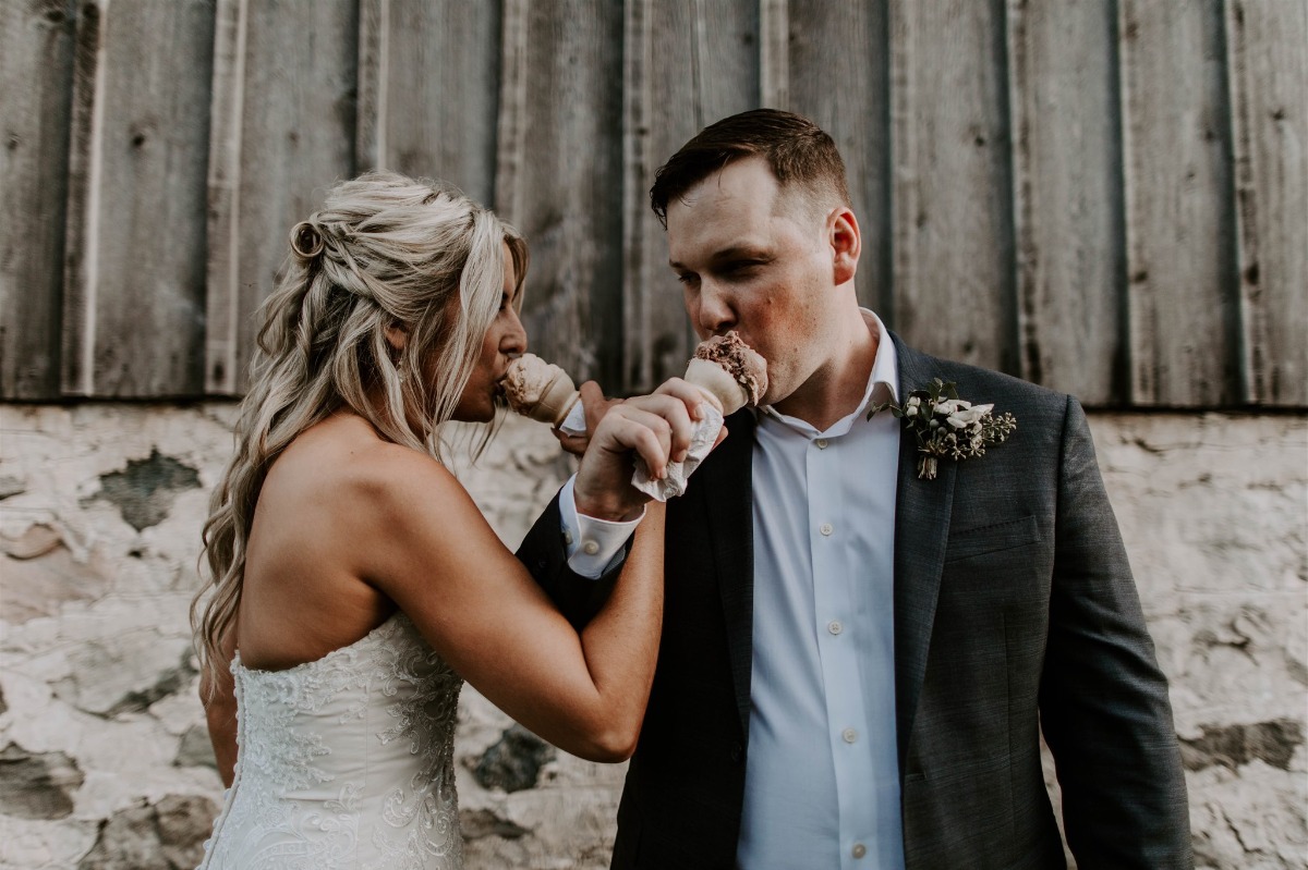 bride and groom sharing ice cream at wedding