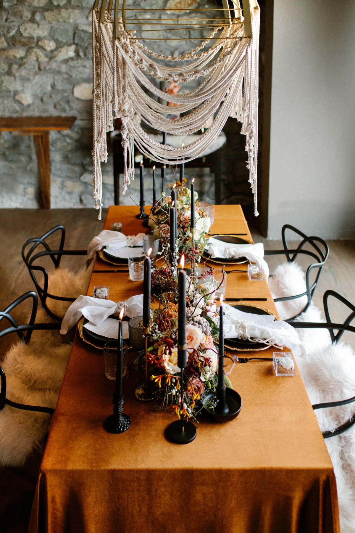 Elegant table setting with candles and floral arrangement