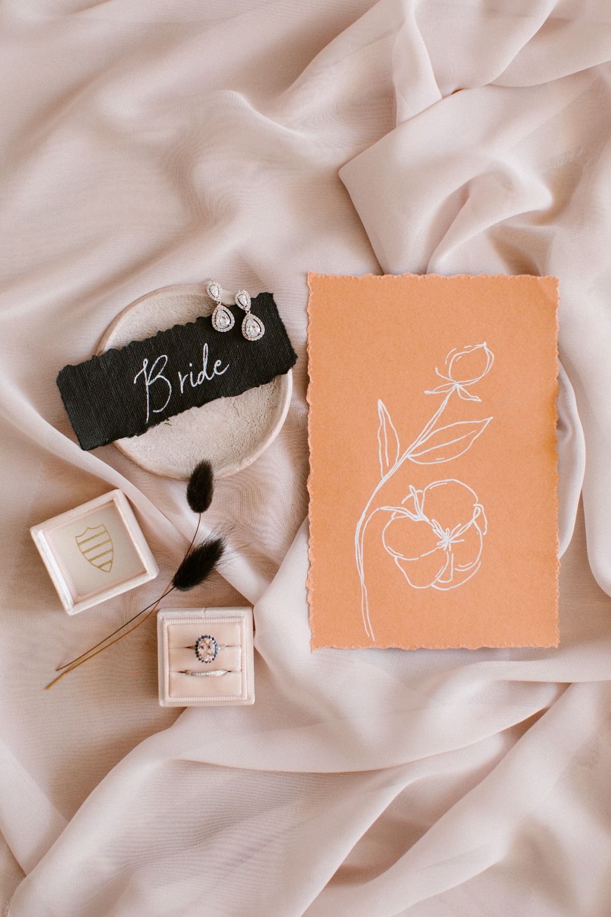 Elegant bridal details with rings and hand-drawn floral art
