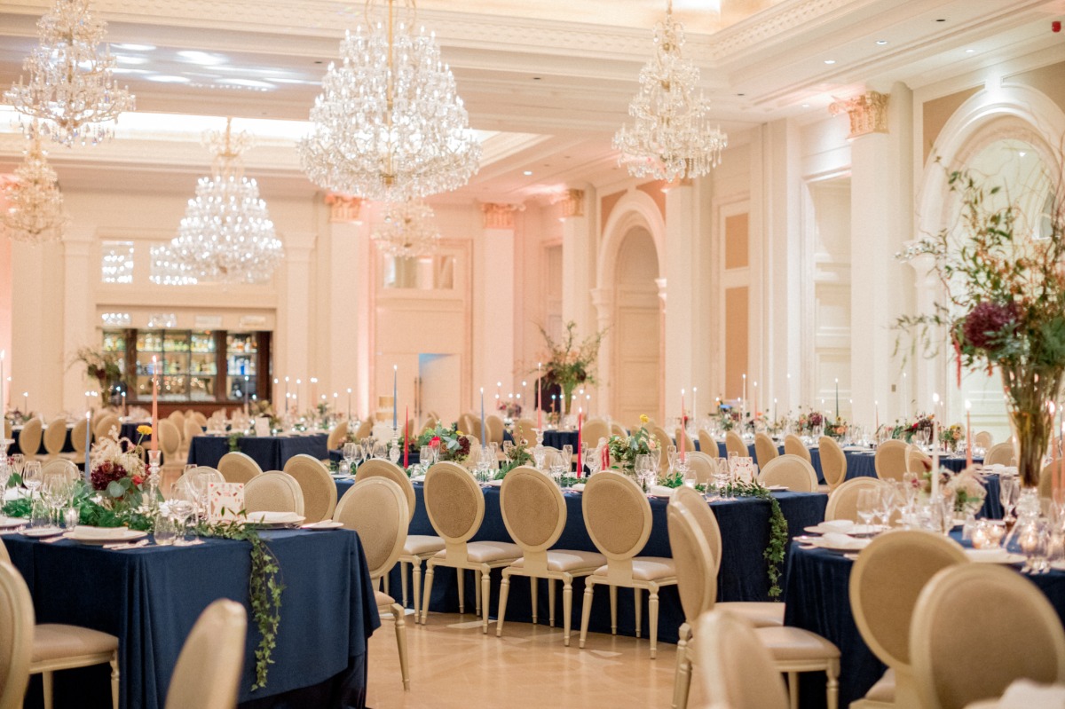 Elegant ballroom wedding reception with crystal chandeliers