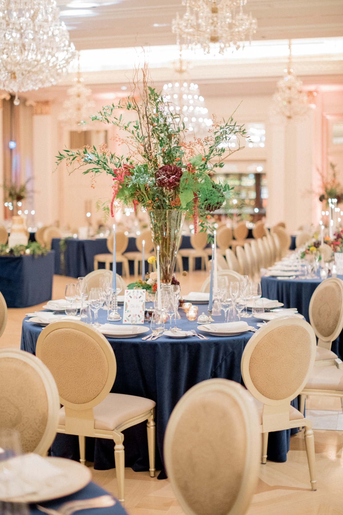 Elegant wedding reception table setting with floral centerpiece