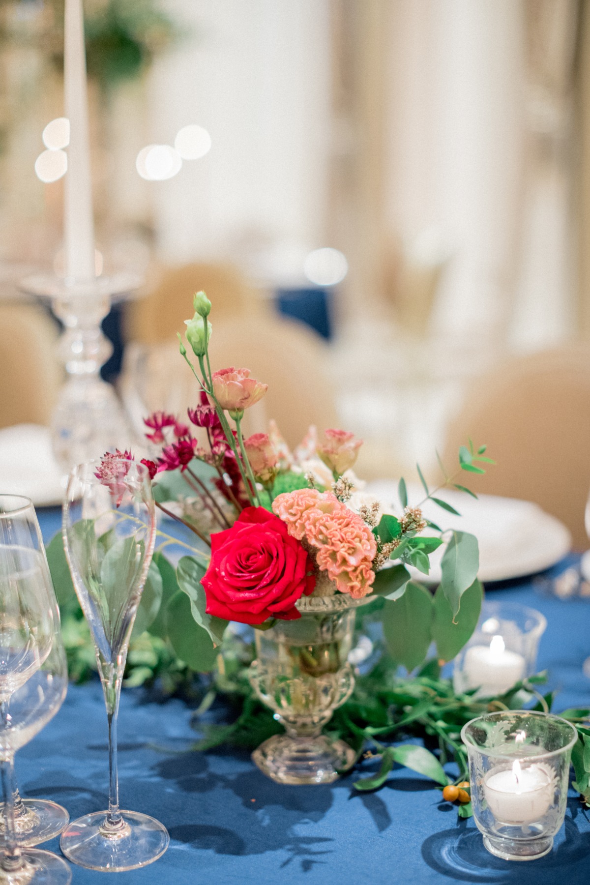 Elegant table setting with a floral centerpiece and candles