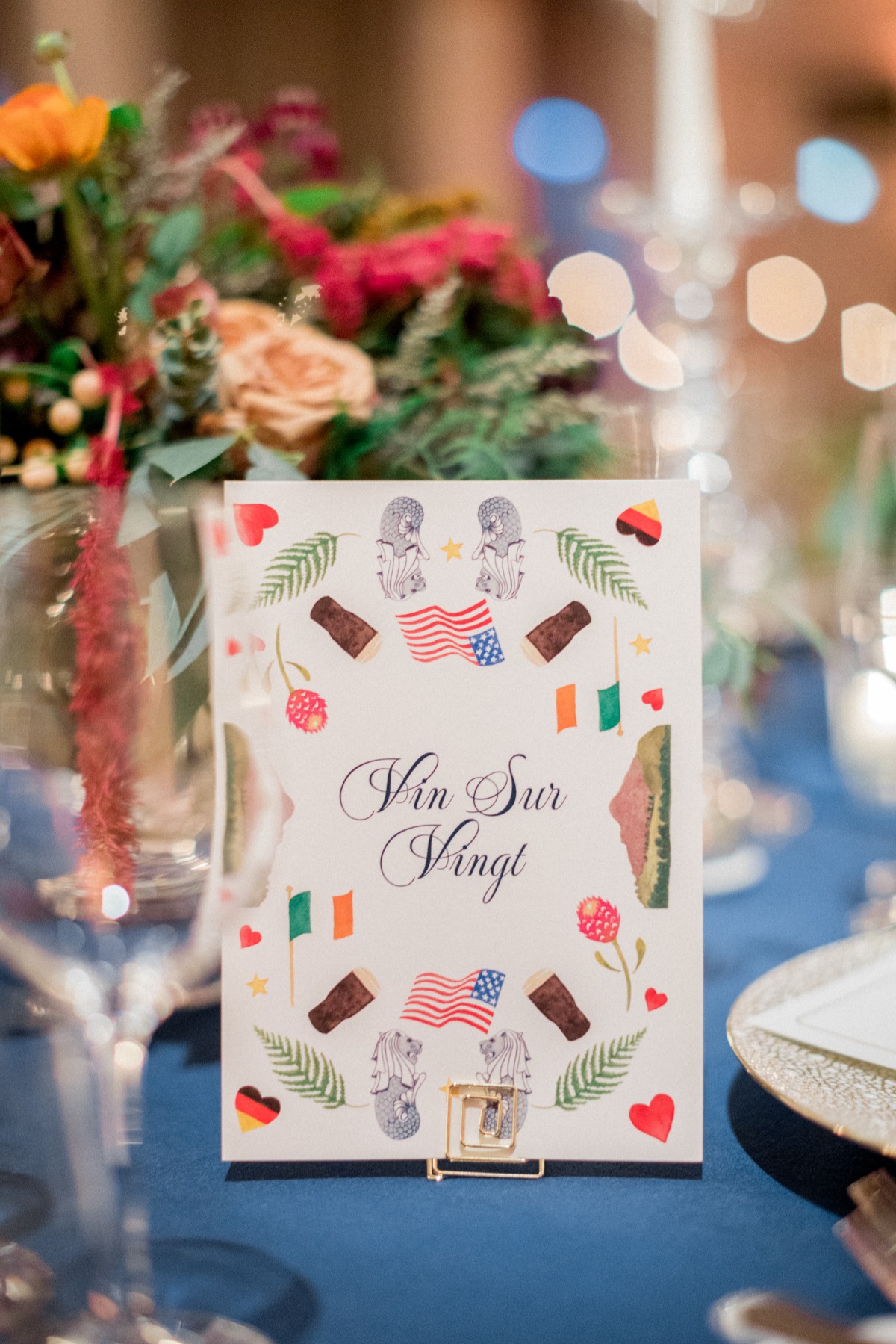 Decorative wedding table card with various country illustrations