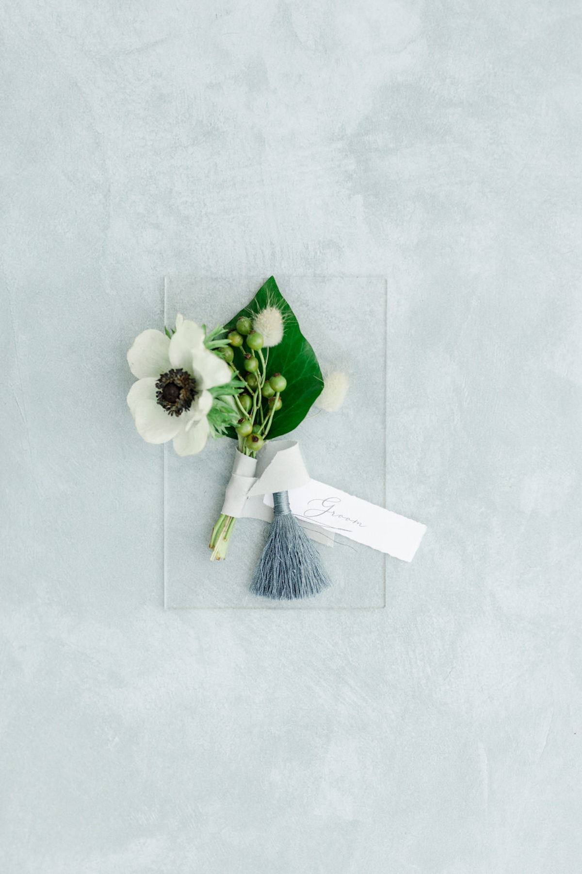 groom boutonniere flat lay