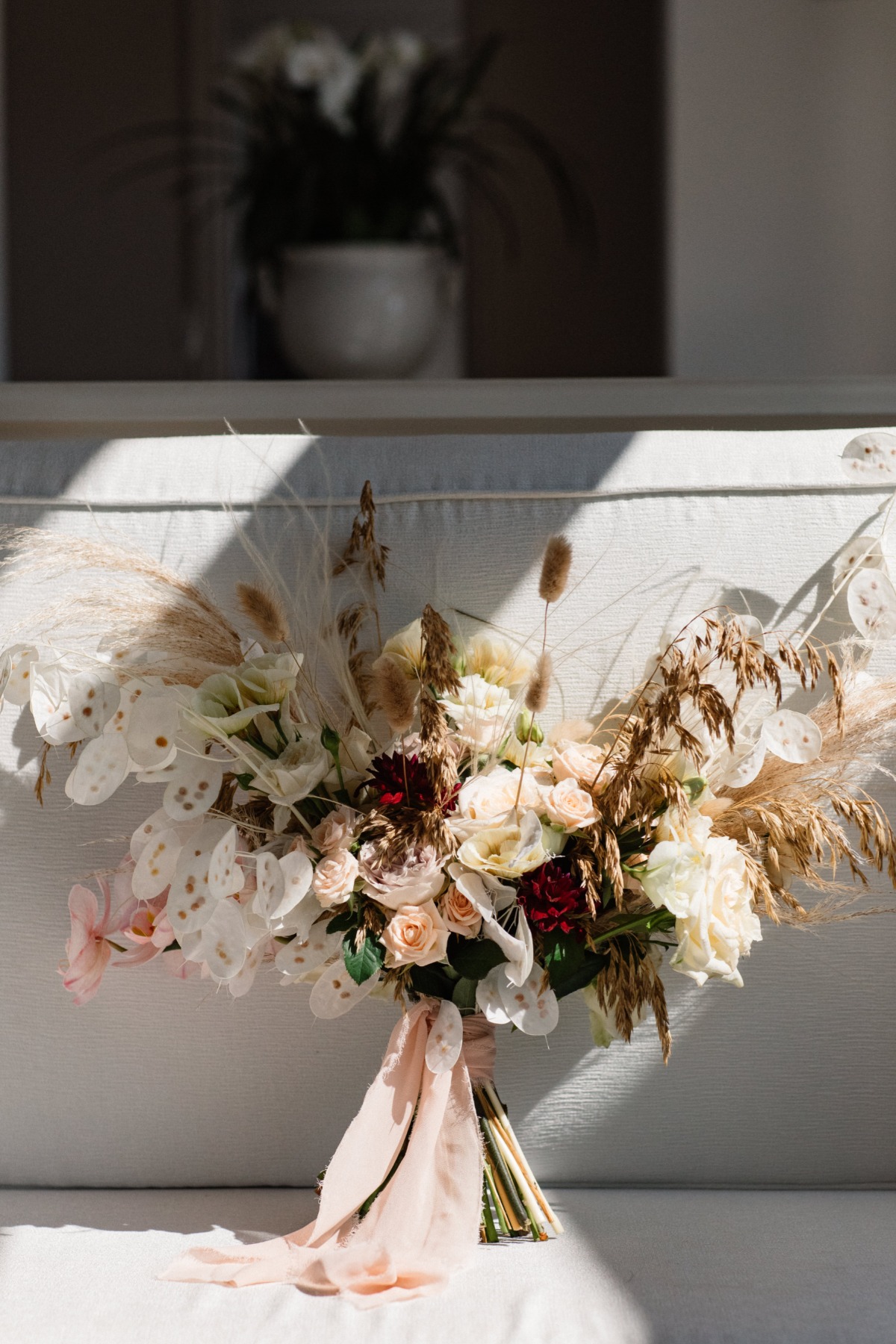 Elegant wedding bouquet with pampas grass and silk ribbon