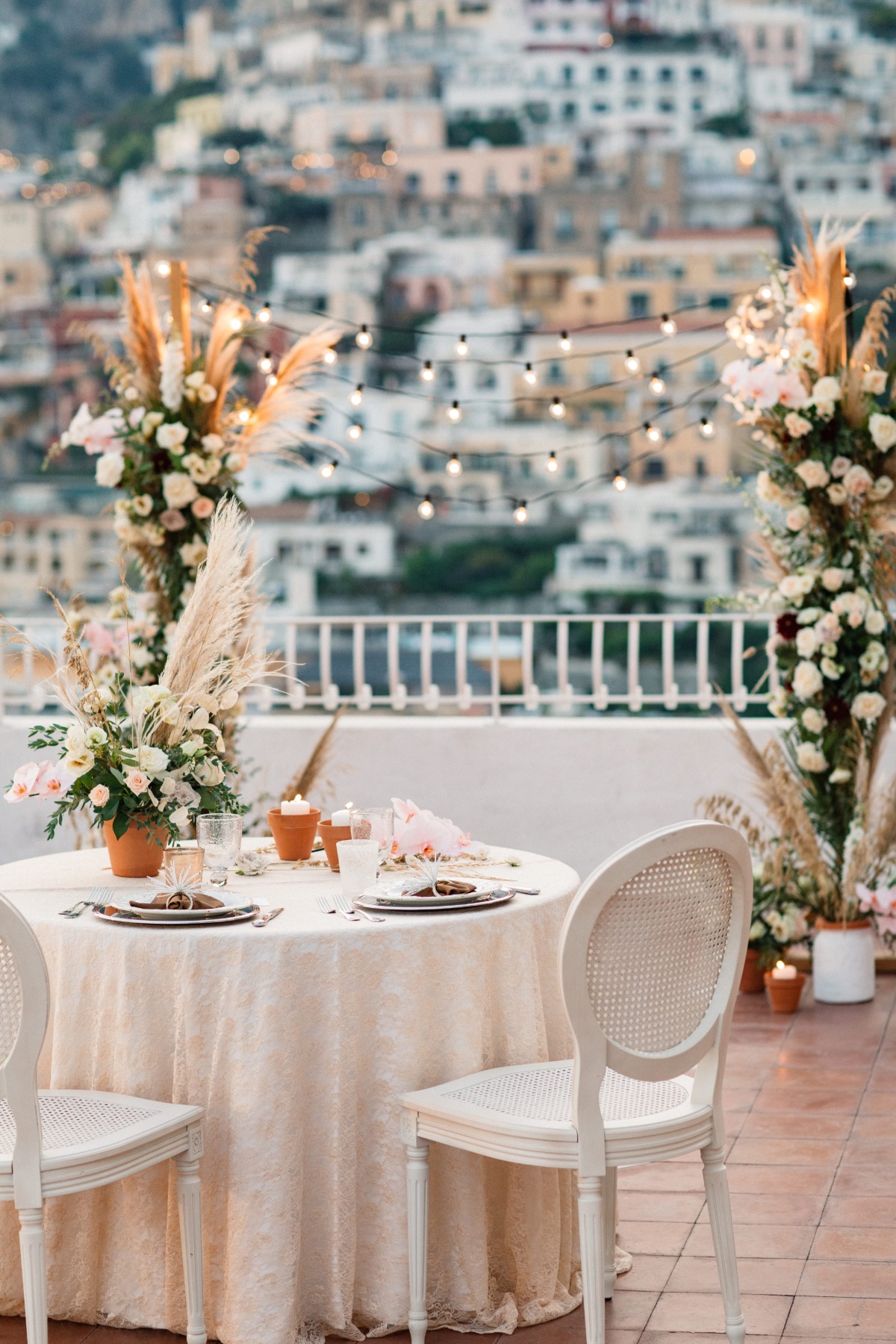Elegant outdoor wedding table setup with city views