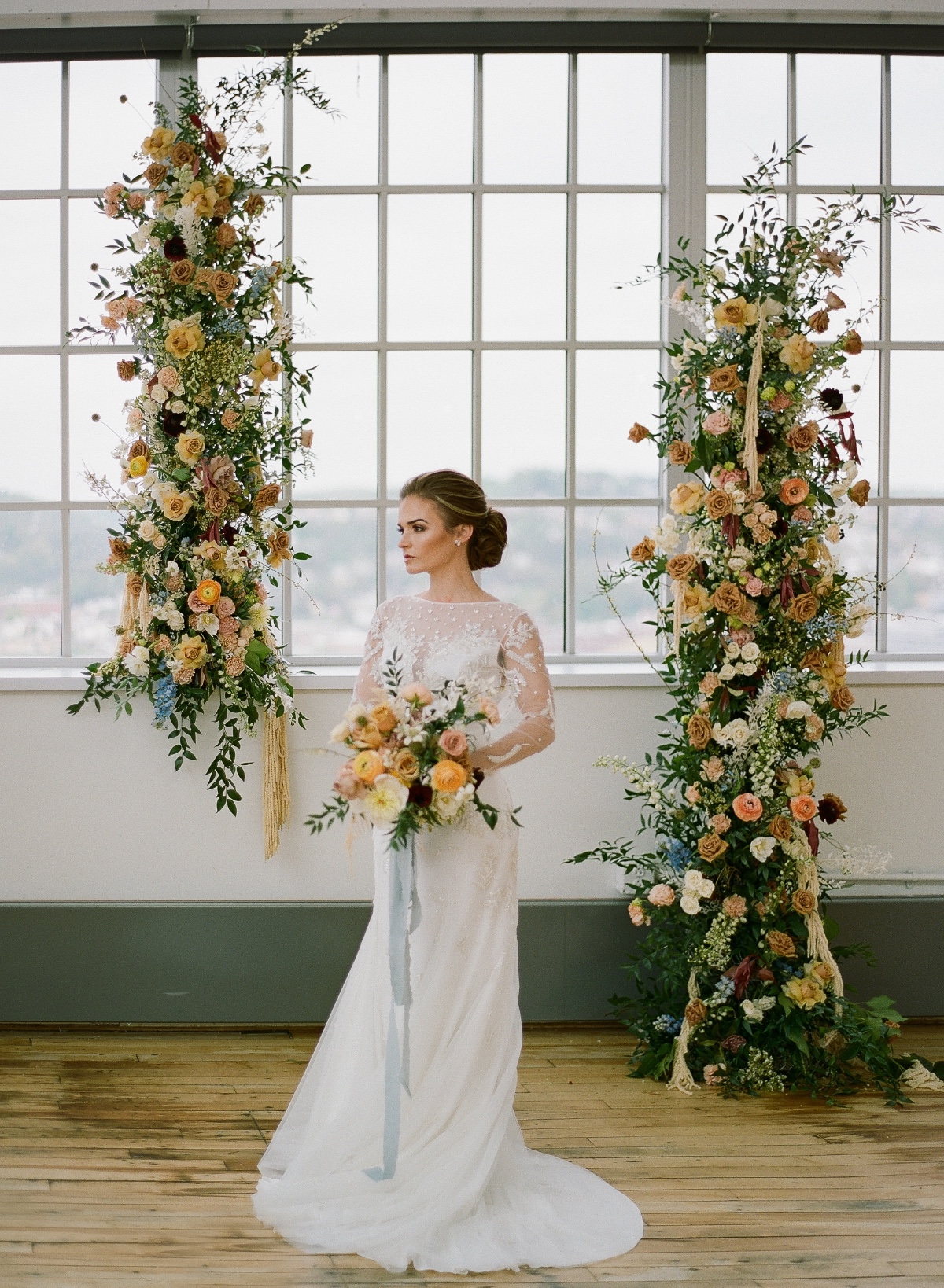 Flower wedding backdrop at warehouse wedding