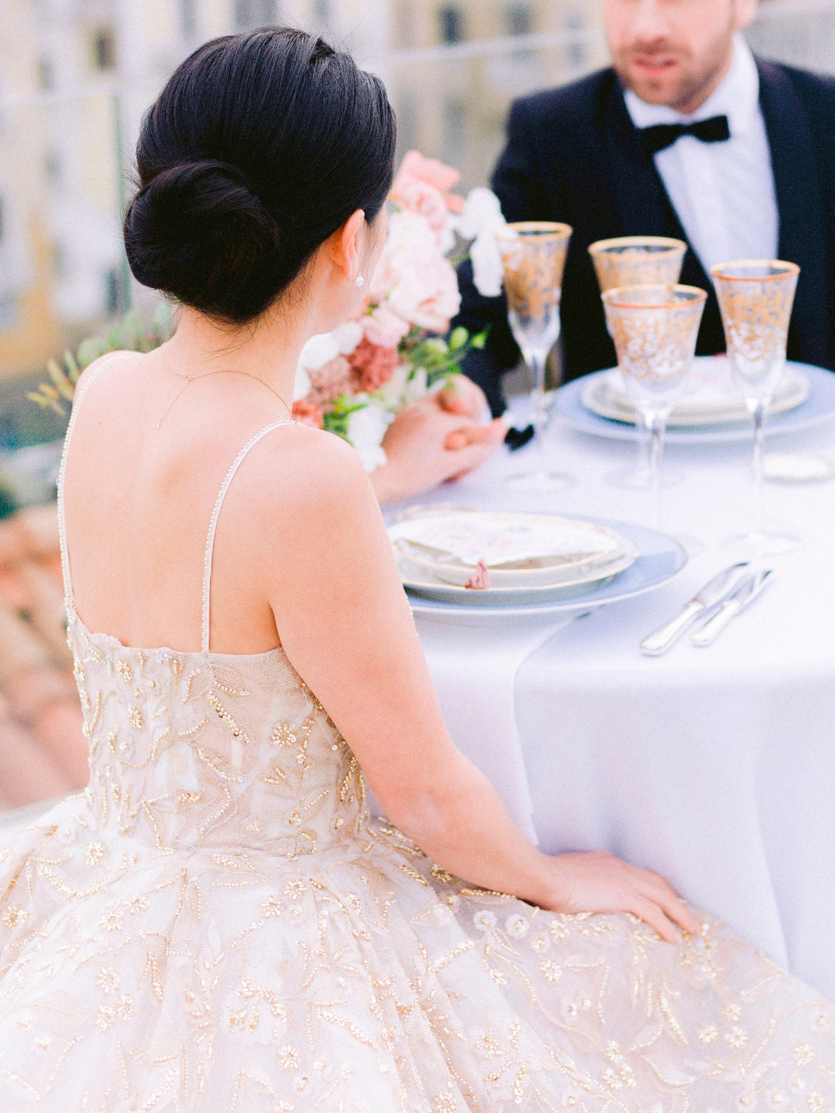 Bride and groom at elegant wedding reception, fine dining outdoors