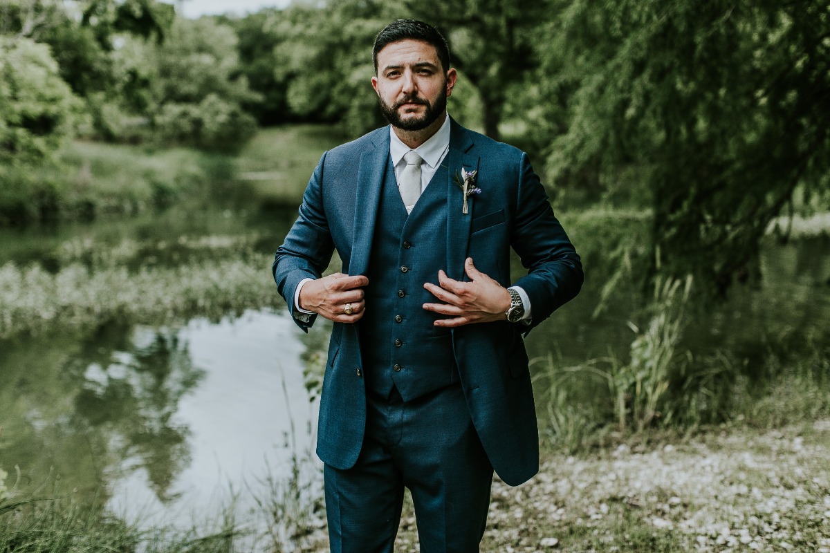 groom in navy blue 3 piece suit