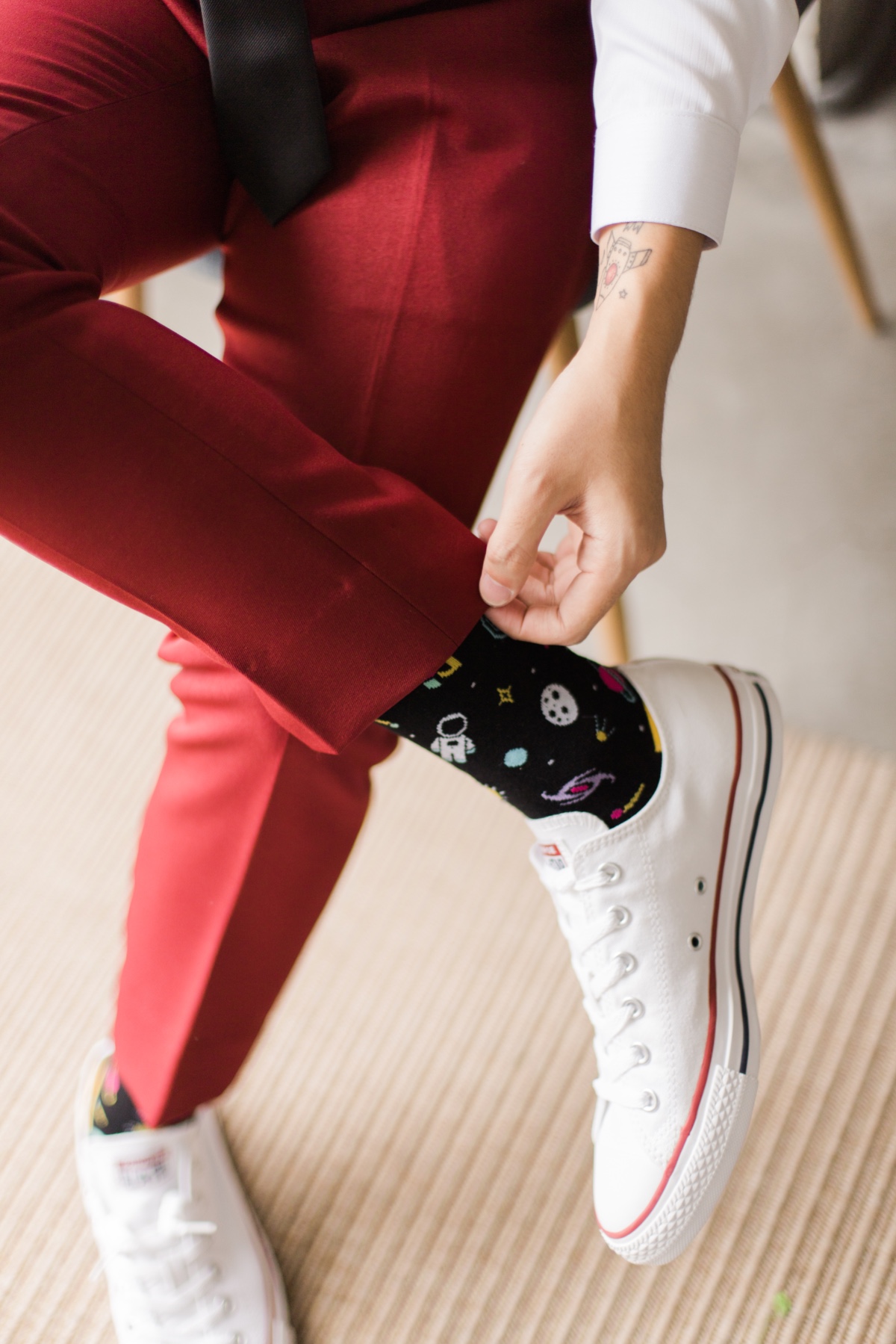groom in converse and space socks