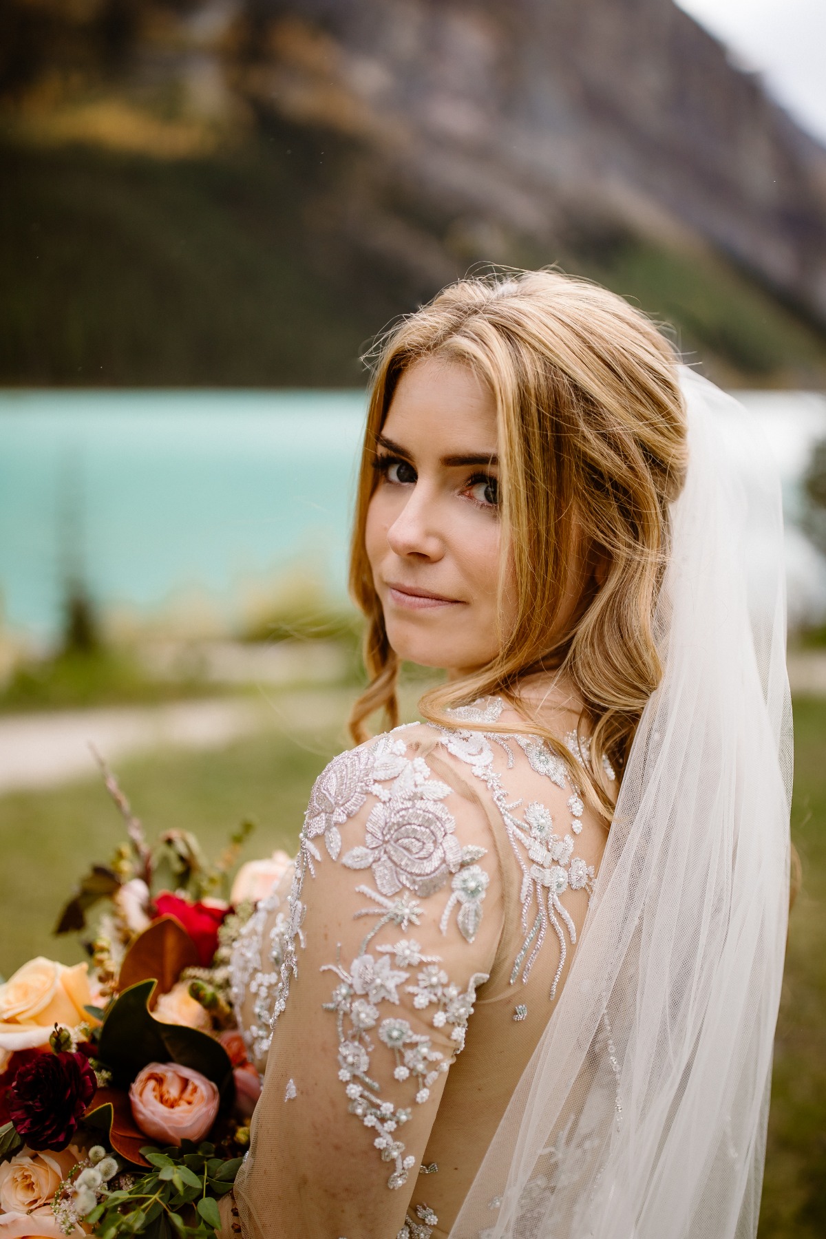bridal portrait in front of Lake Louise in Banff National park