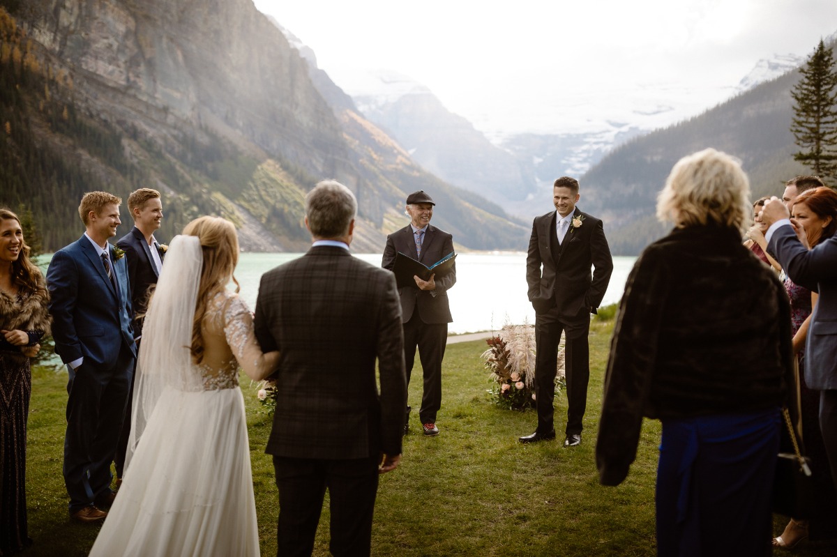 Intimate wedding ceremony in front Lake Louise
