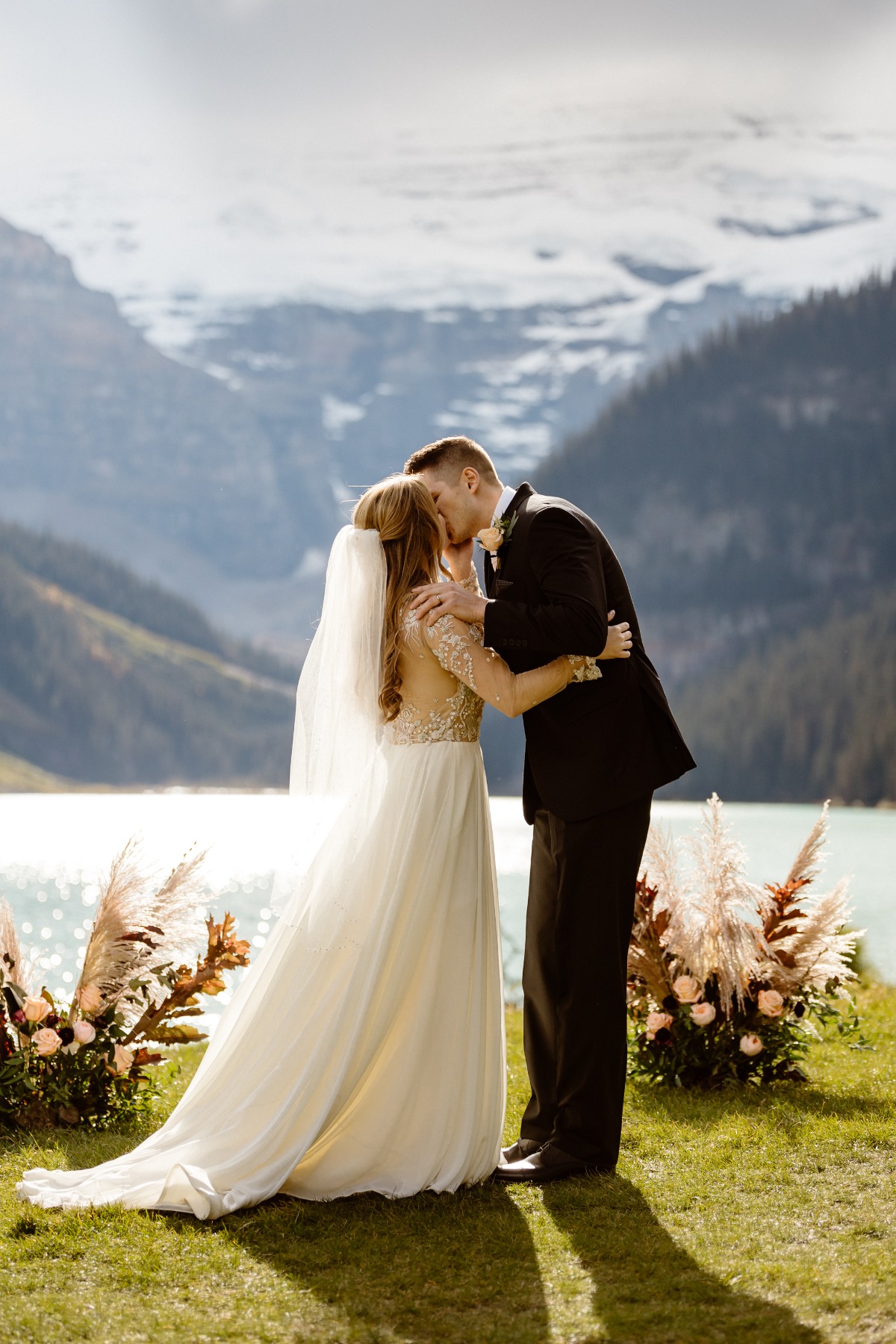 Intimate wedding ceremony in front Lake Louise