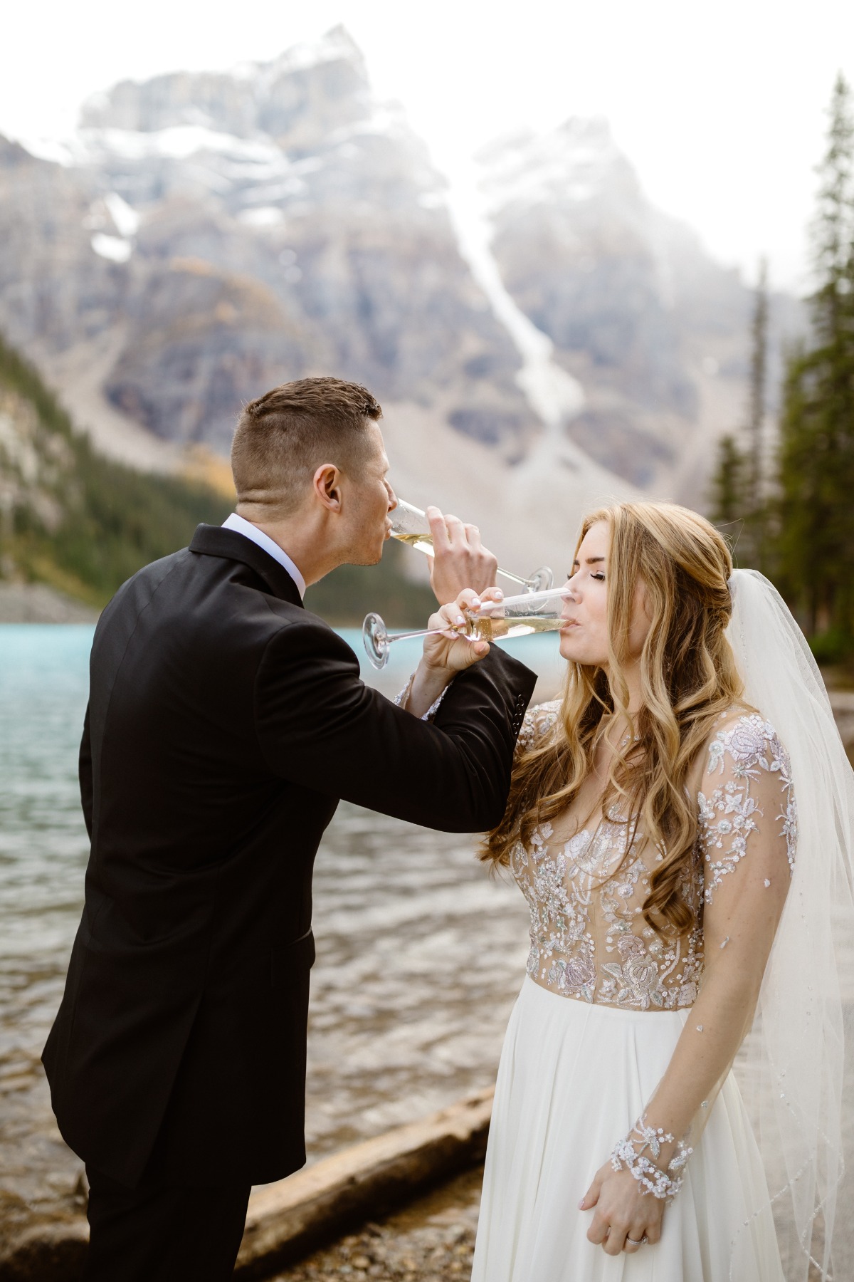 Champagne toast on shore of  Moraine Lake