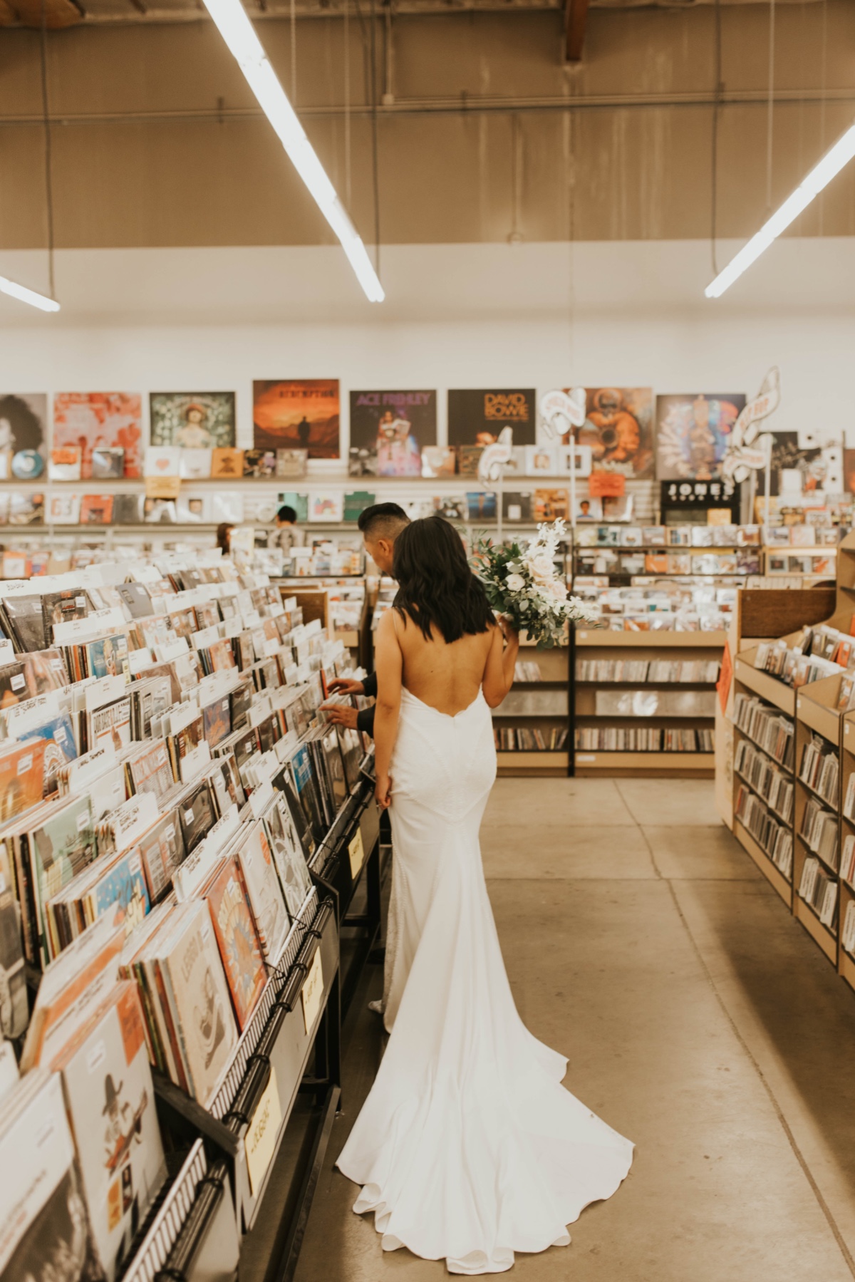 wedding party goes to record store on wedding day