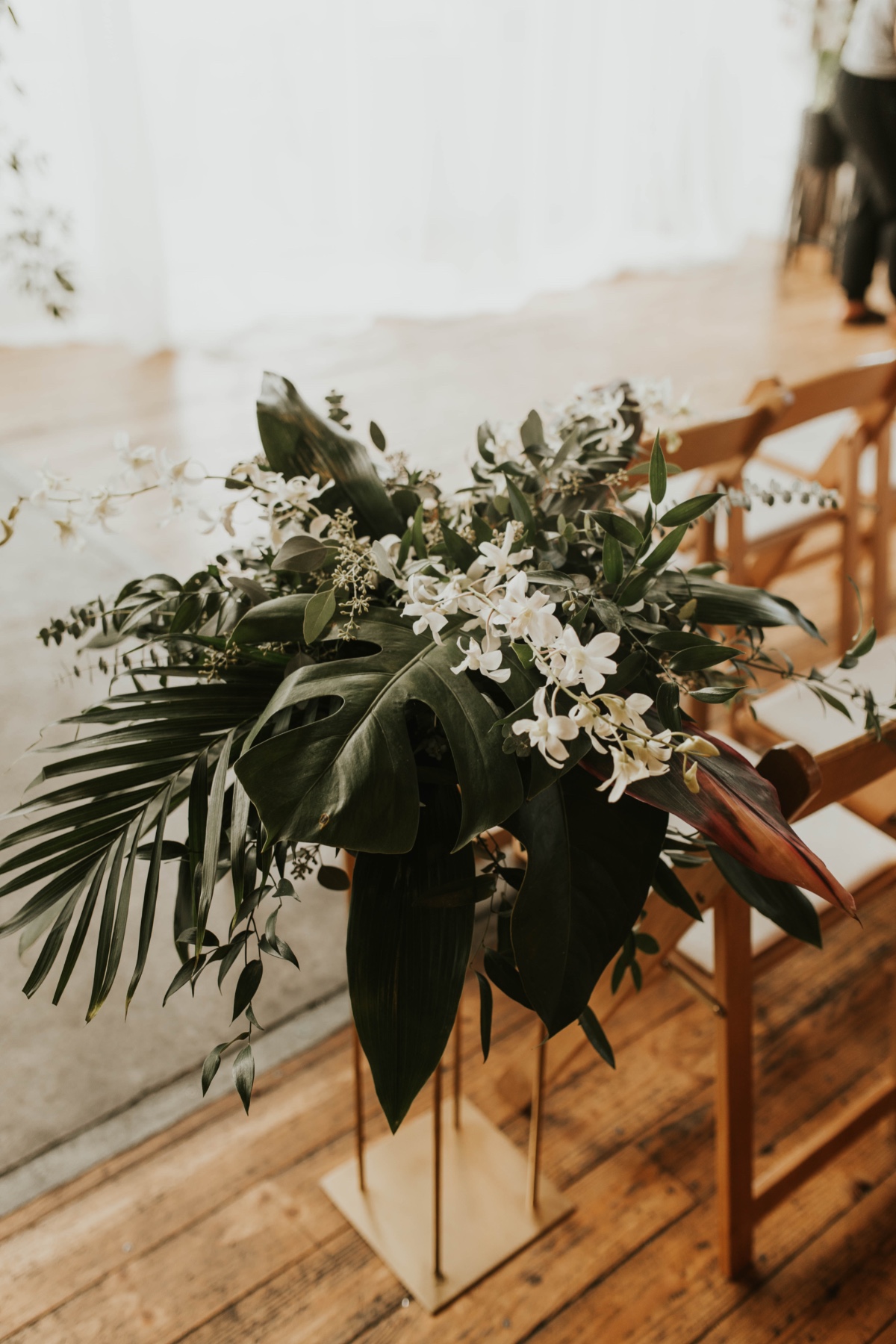 tall floral arrangements used as aisle runners
