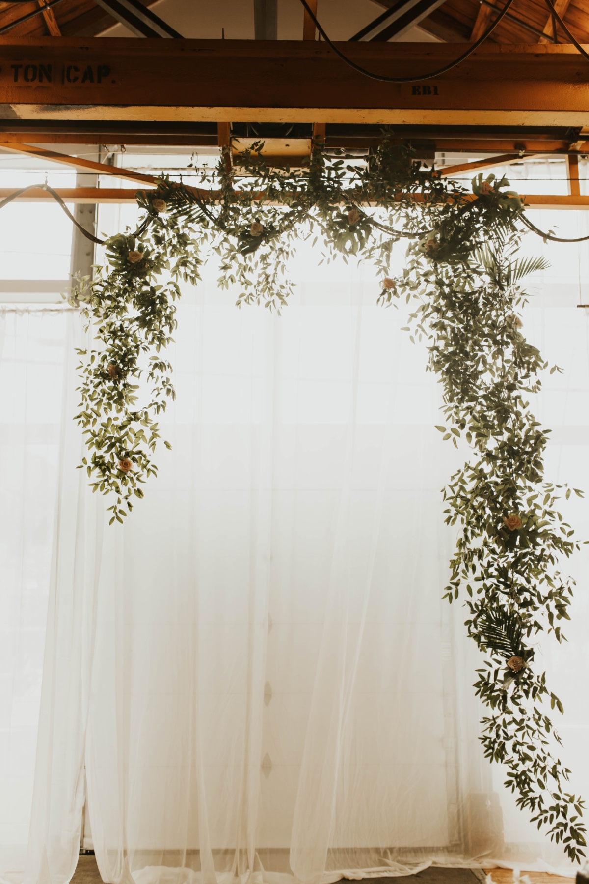 greenery hung for wedding backdrop