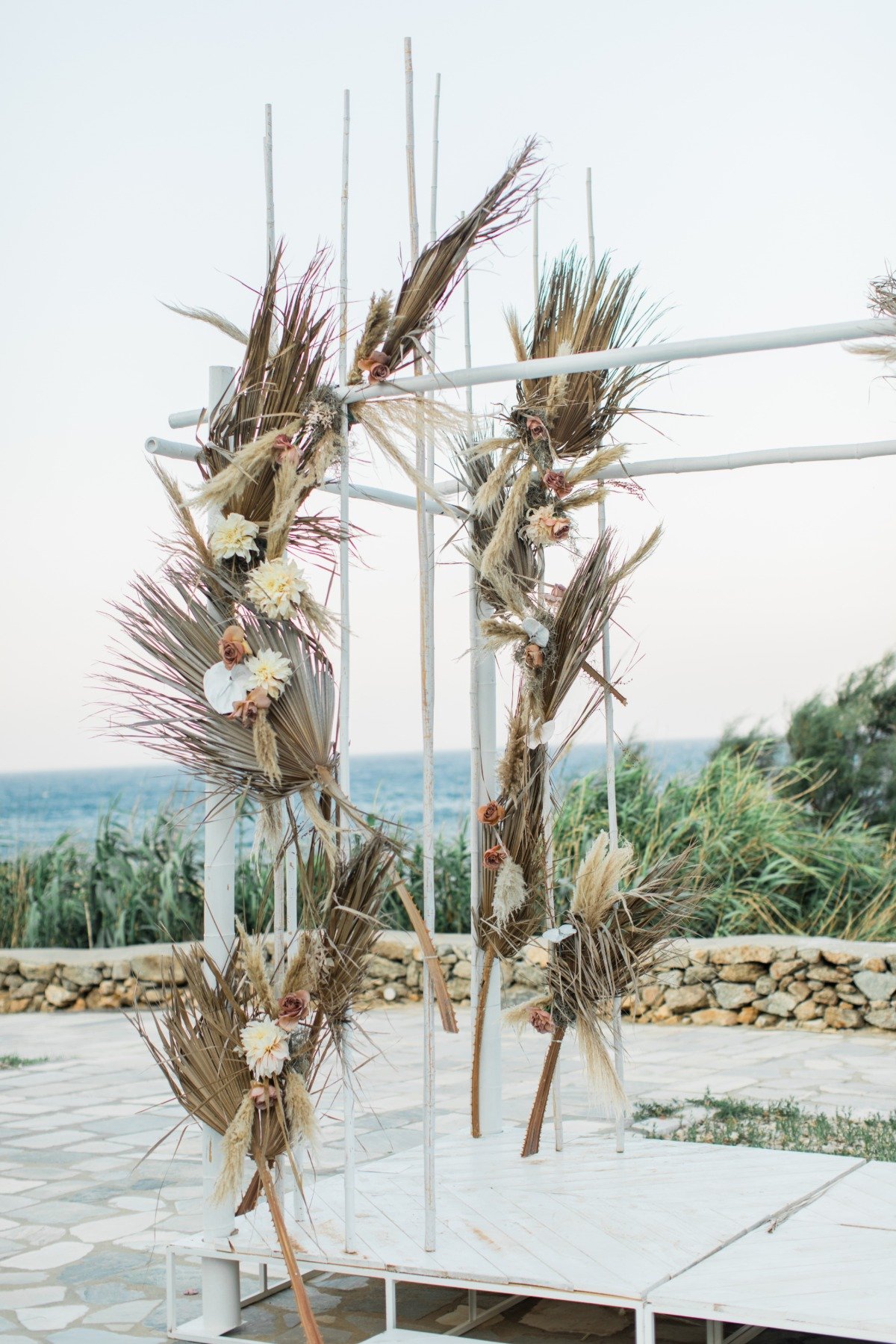 Dried floral backdrop from Greece wedding rentals Ceremonies by Rakor