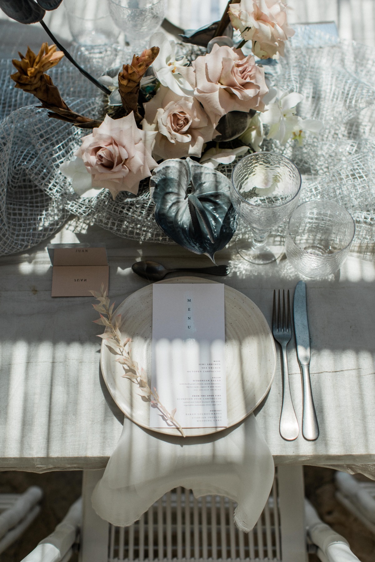 neutral wedding centerpiece with gray anthurium