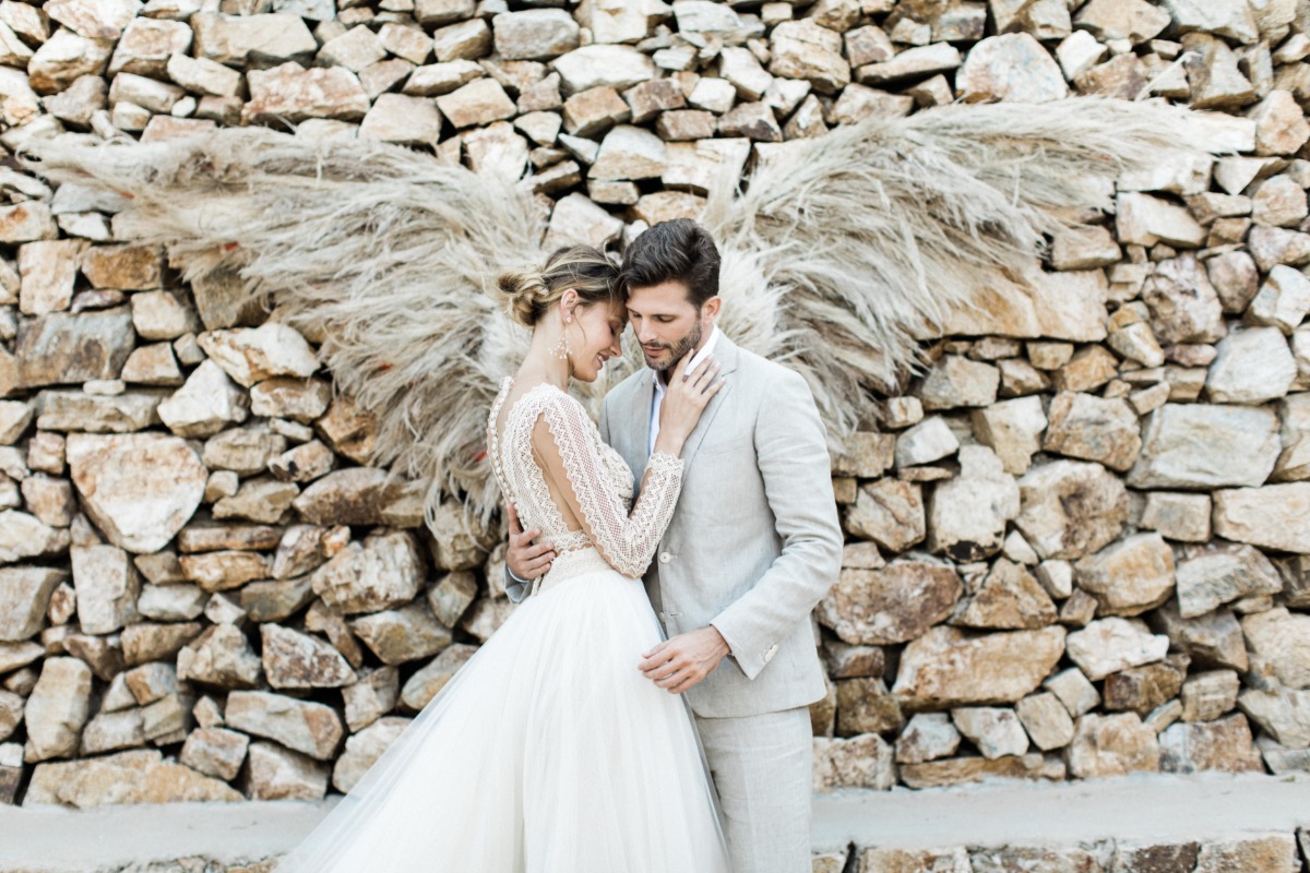 angel wing wedding backdrop created out of dried grasses