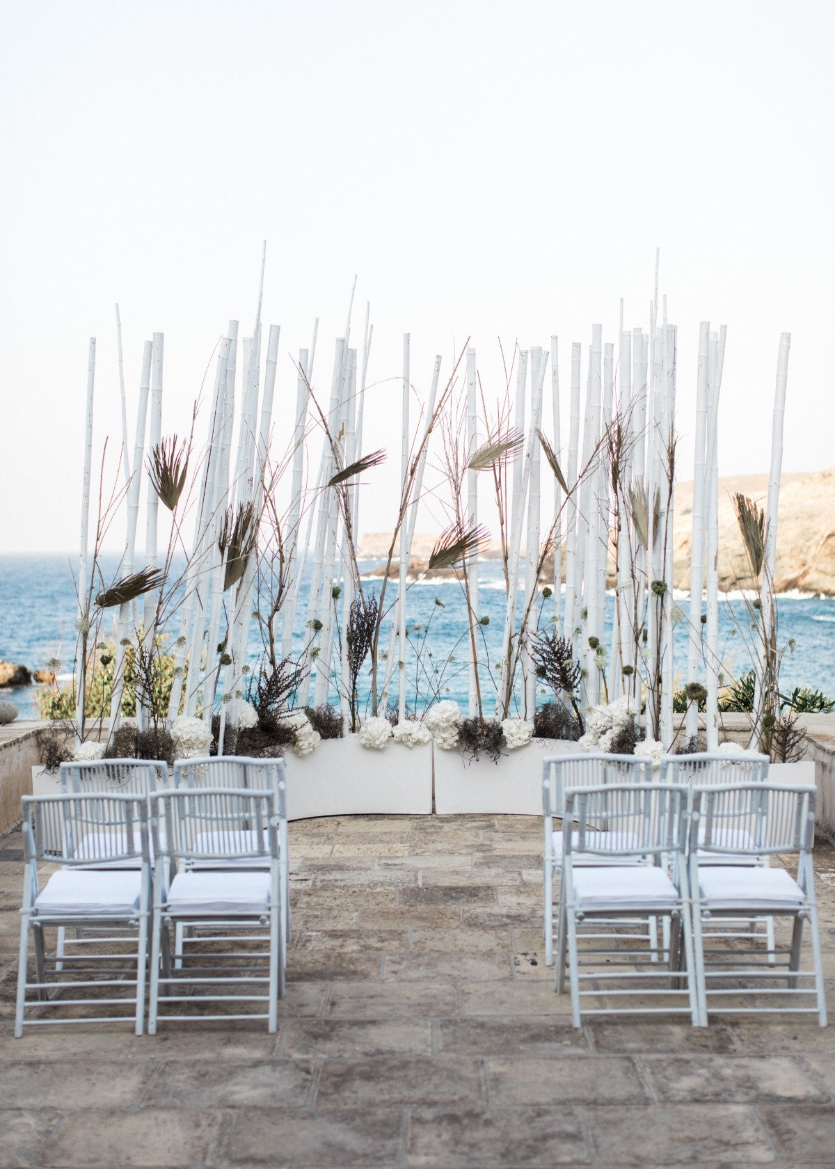 Greece wedding with bamboo wedding backdrop from Ceremonies by Rako