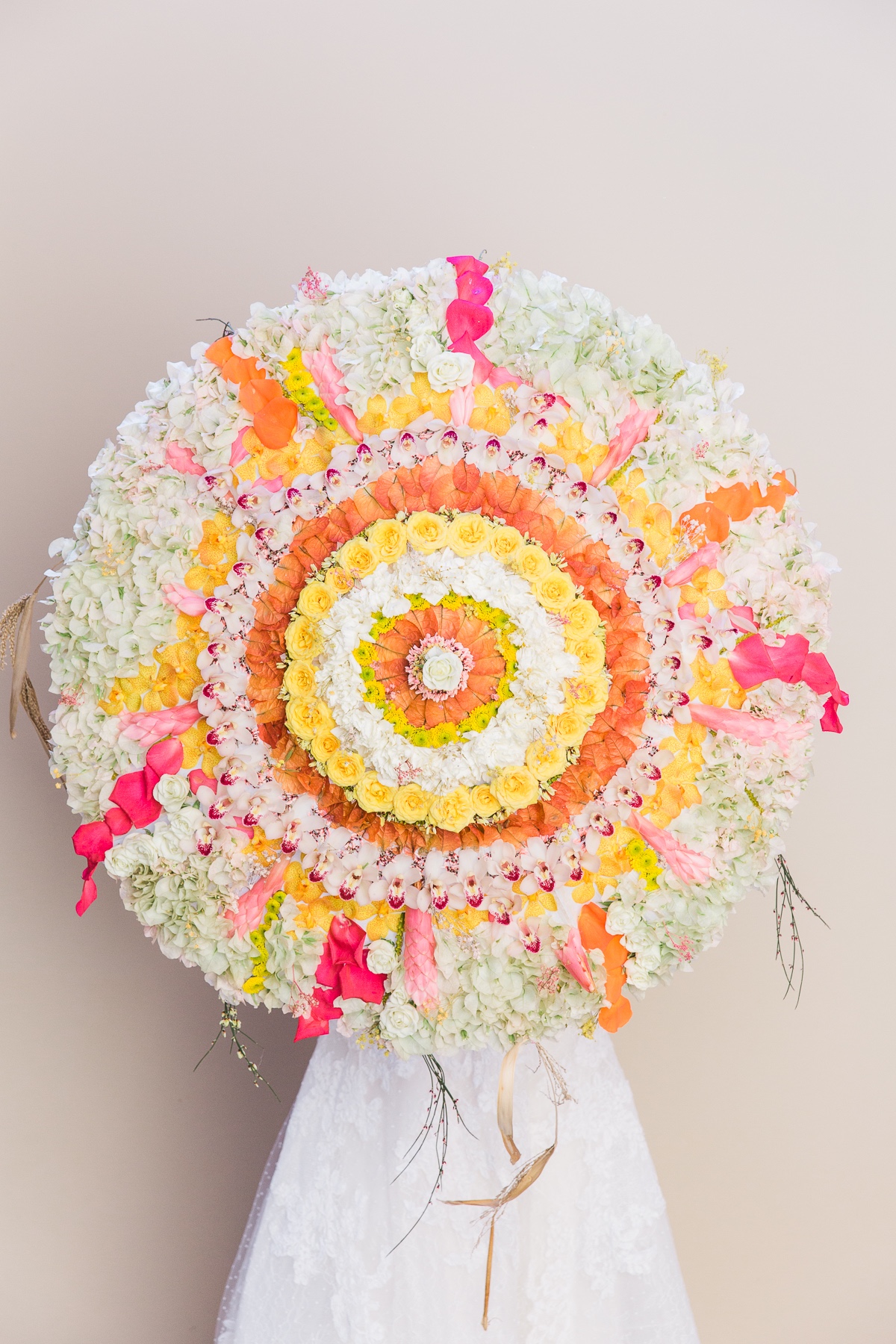 umbrella that is decorated with florals by Grace Flowers
