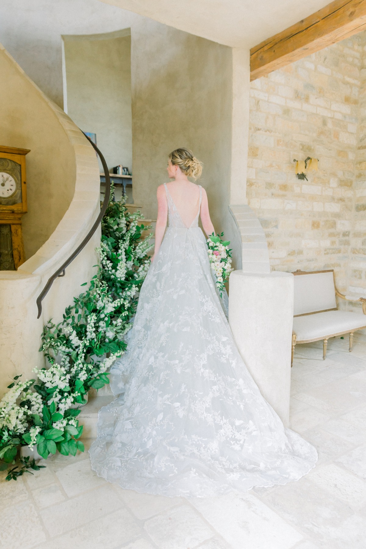 Hailey Paige Bridal wedding gown walking up staircase at Sunstone Villa