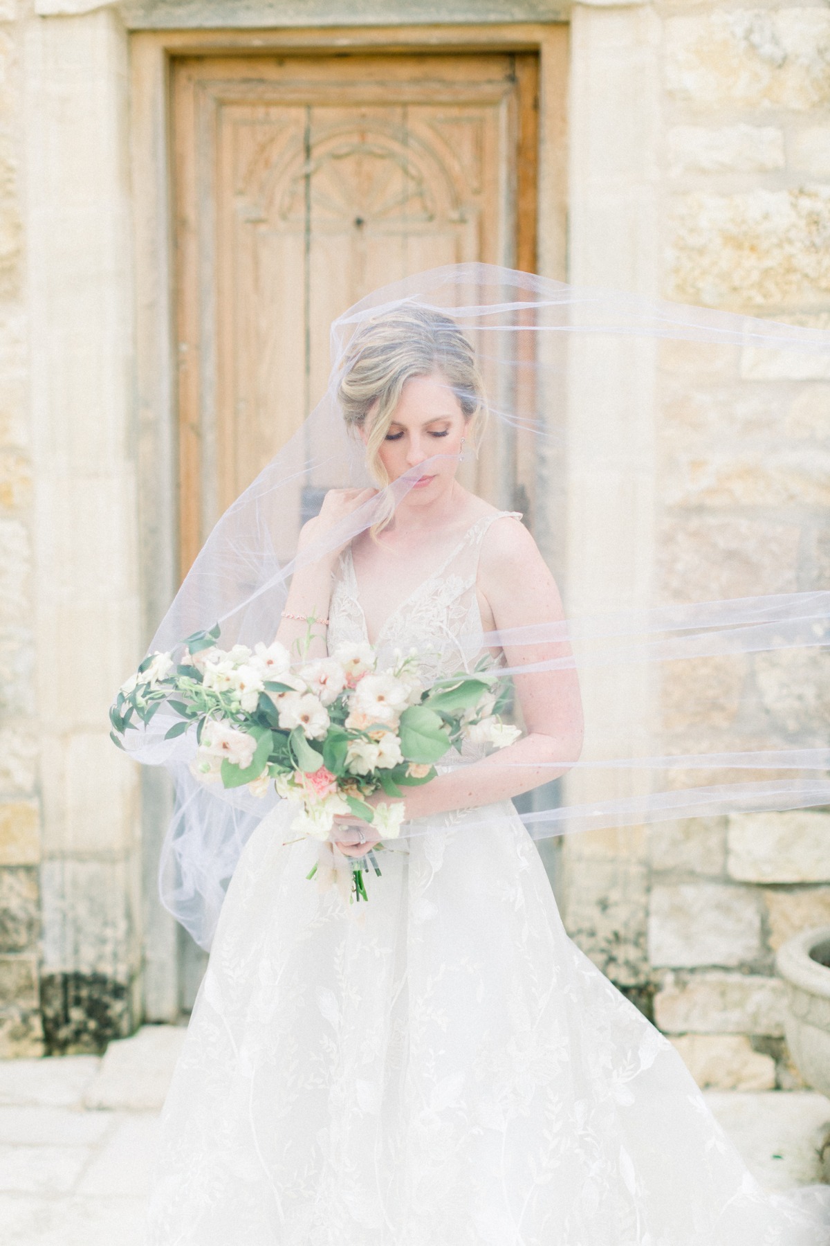 Haley Paige wedding gown with bouquet by Tyler Speier Events