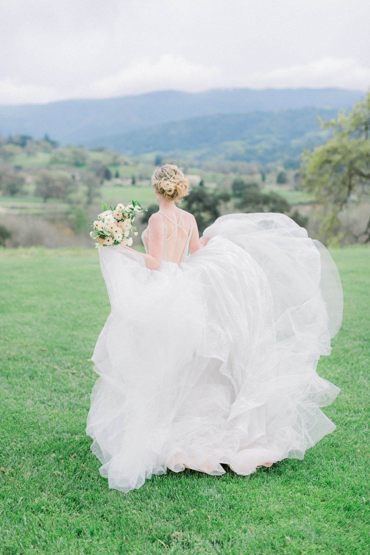 Haley Paige wedding gown with bouquet by Tyler Speier Events