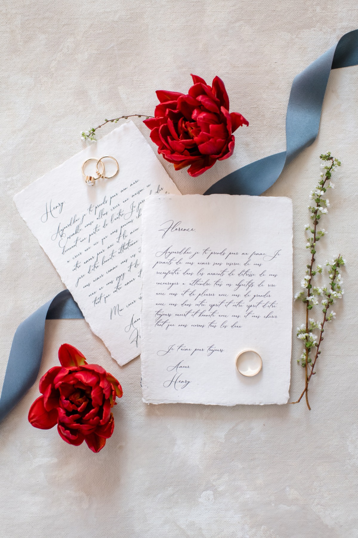 Romantic wedding invitation with rings and flowers