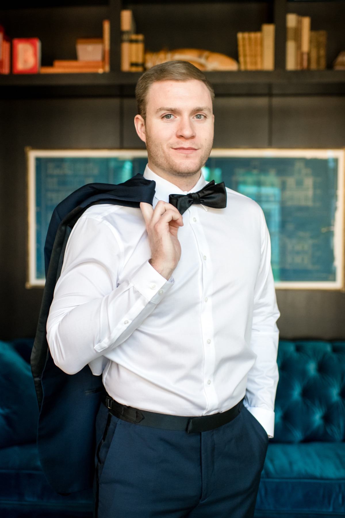 Well-dressed man in a white shirt and bowtie with a suit jacket