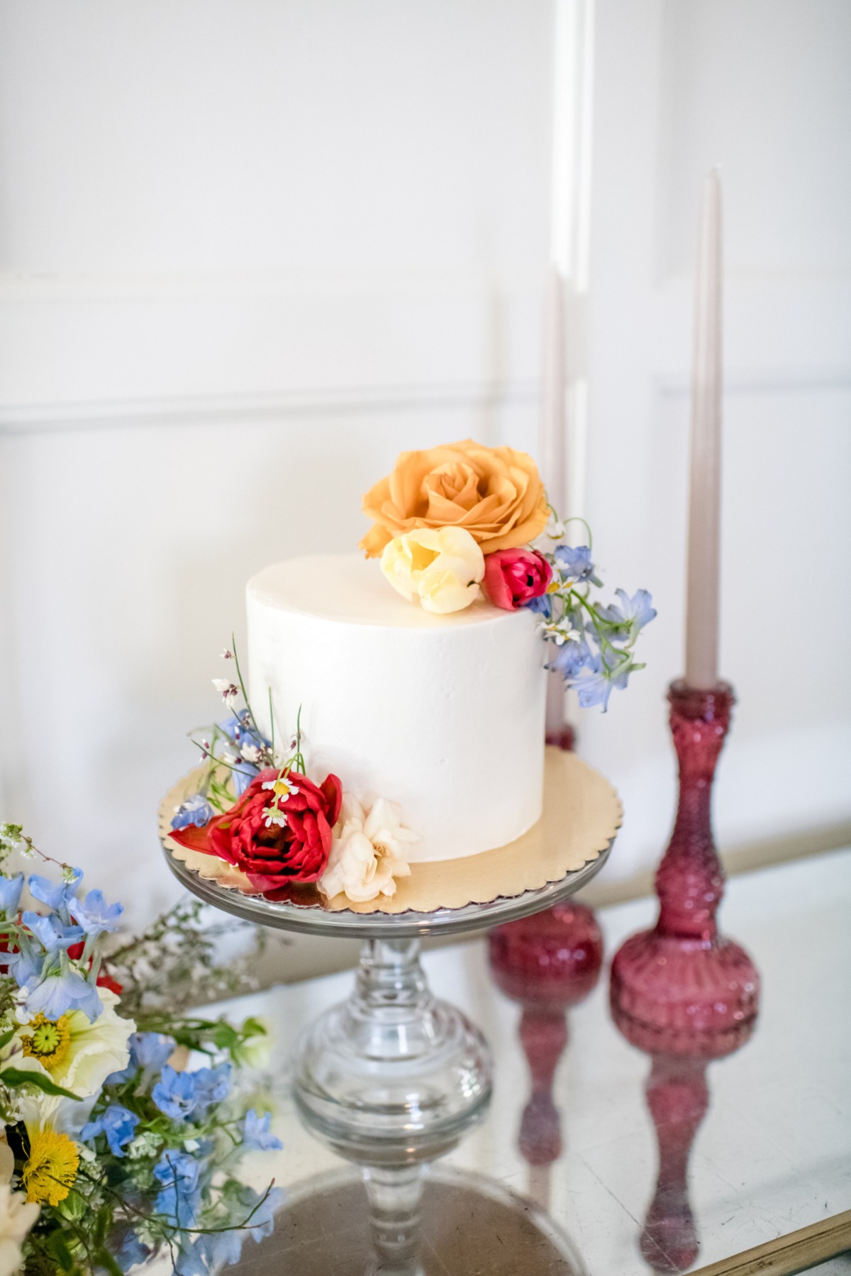 small white wedding cake adorned with florals