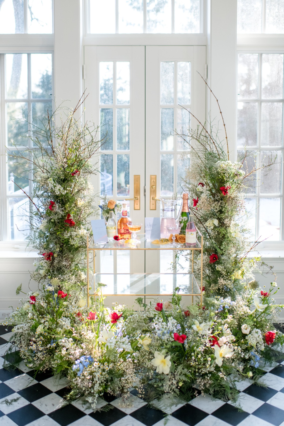 Elegant bar cart decorated with flowers, perfect for a celebration