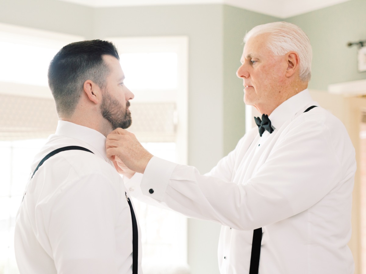 groom getting wedding ready with his Dad