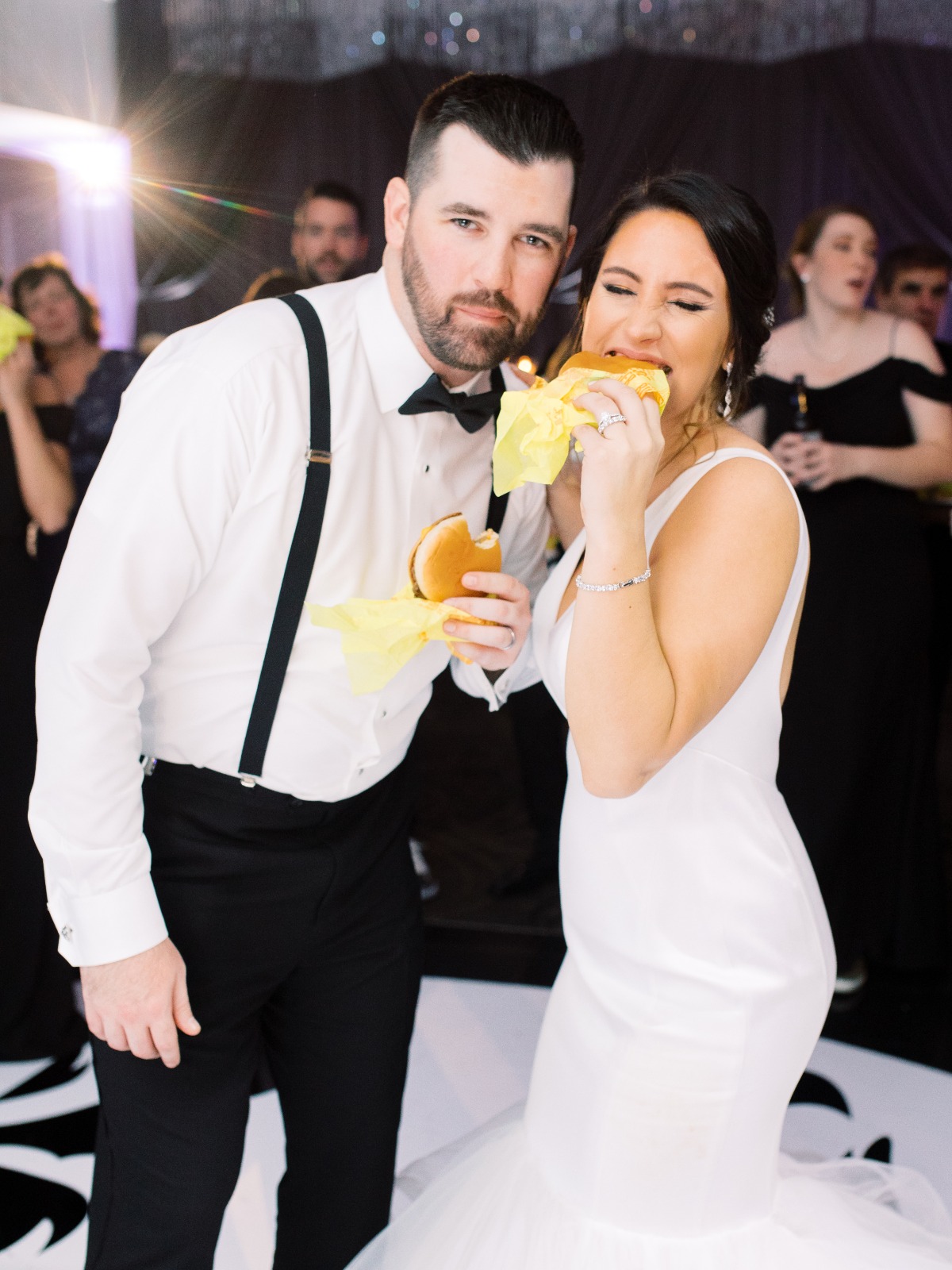 Bride and Groom Eating Cheeseburgers
