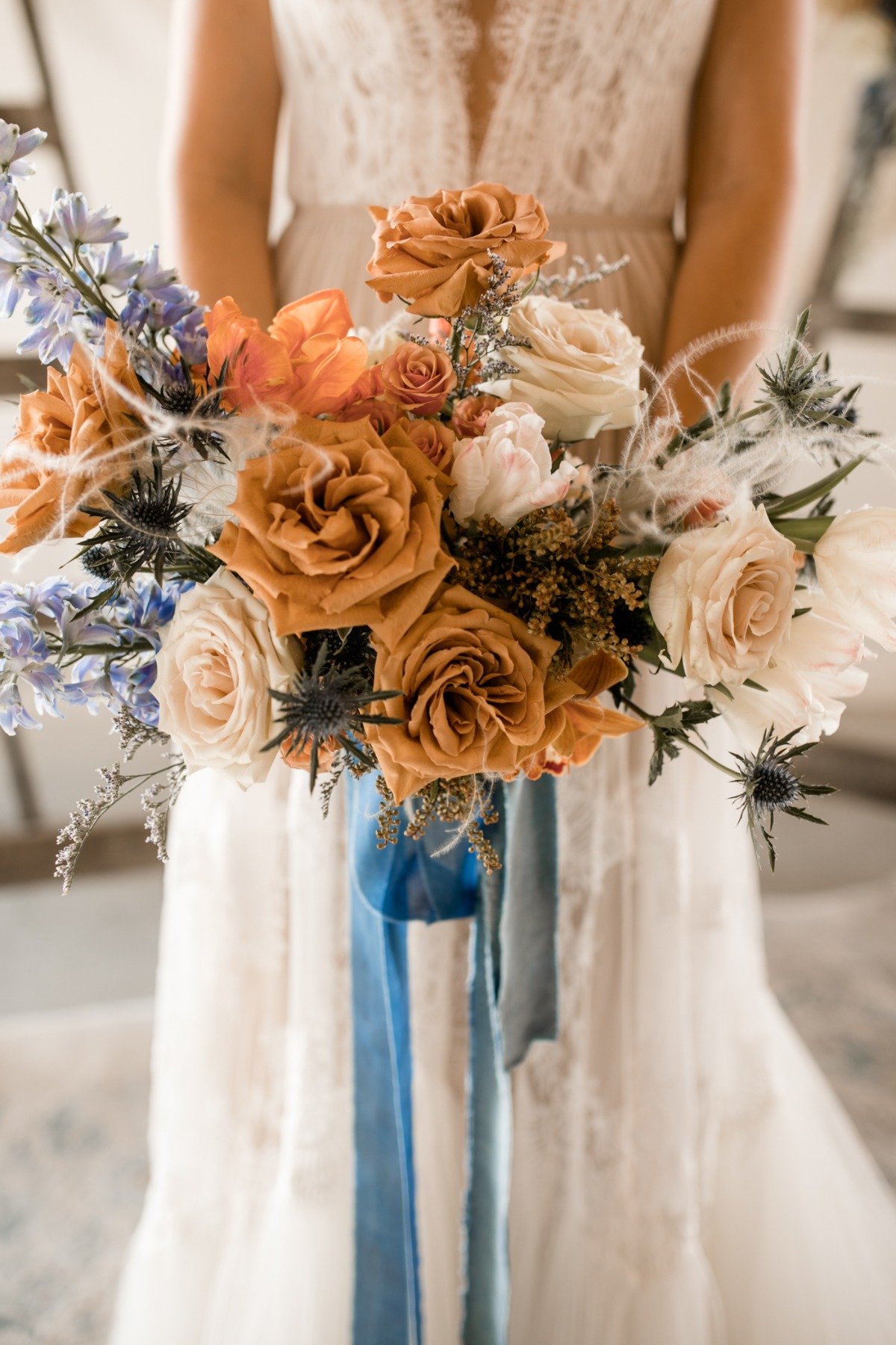whimsical blue, orange and white wedding bouquet by Flourish & Knot
