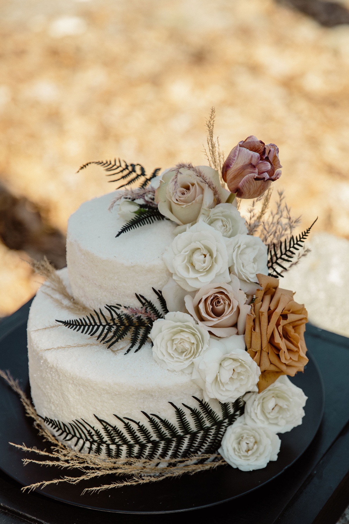 woodsy wedding cake with romantic florals