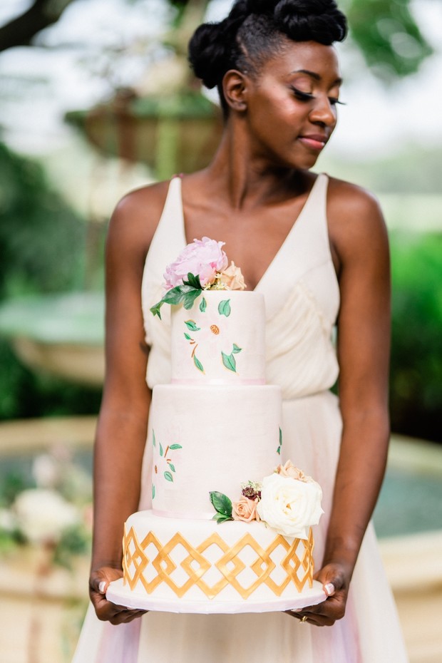 bride holding cake