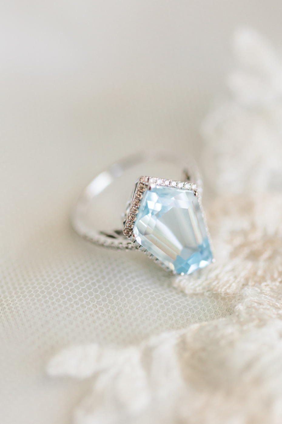 Aquamarine gemstone ring on delicate white lace