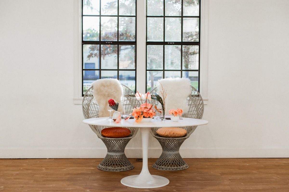 Cozy dining setup with floral decor and unique chairs